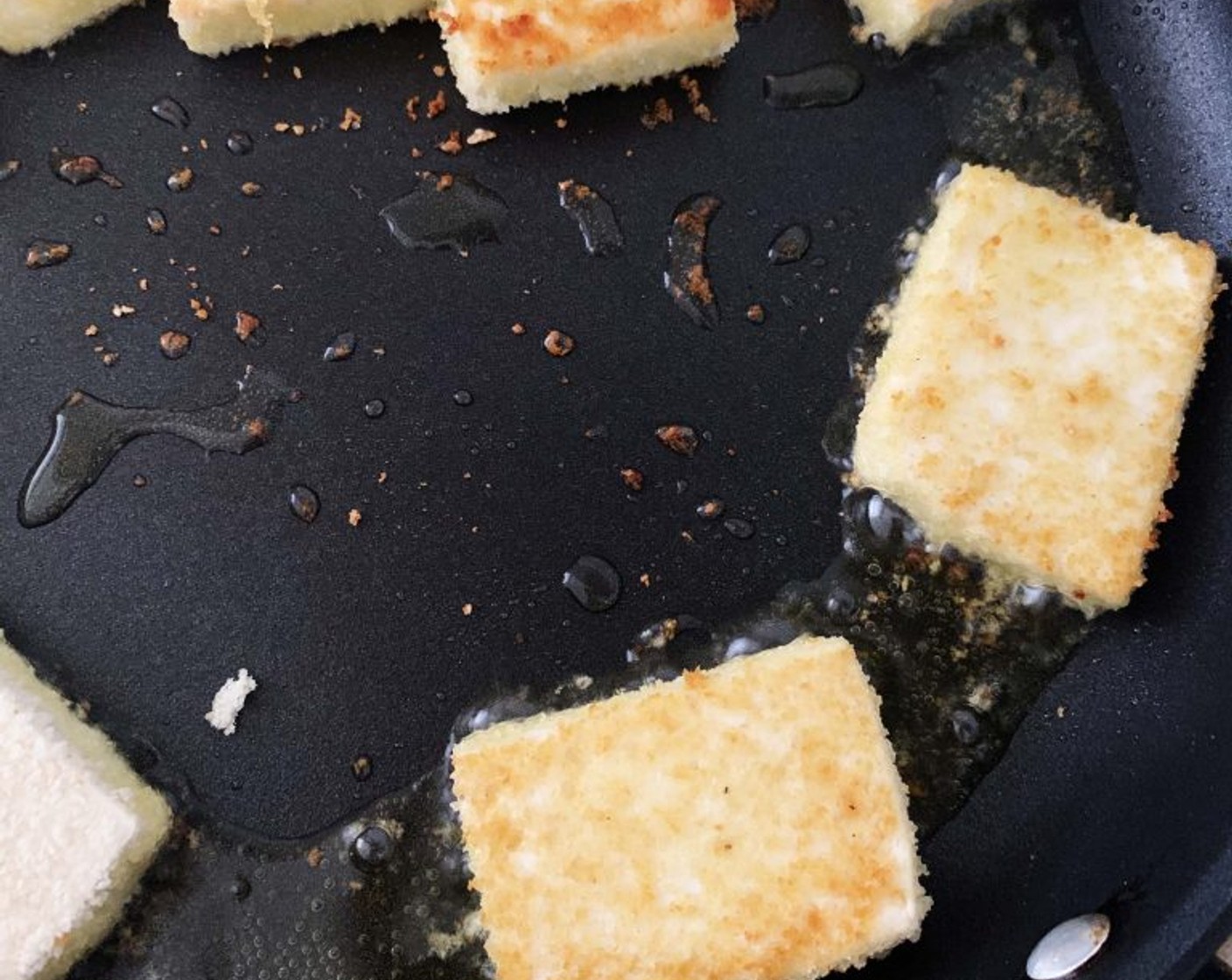 step 4 In a skillet heat Oil (as needed) over low-medium heat and pan-fry the tofu cubes until they turn golden brown on both sides.