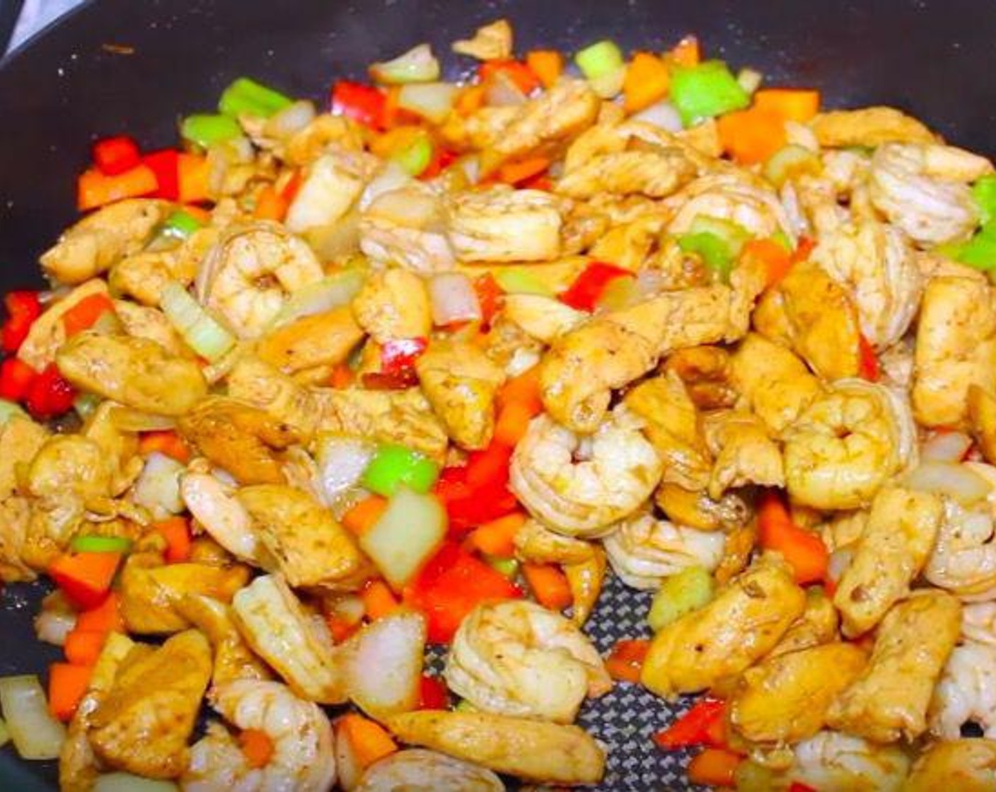 step 3 In the same pan, cook chicken and Shrimp (24), Onion (1), Celery (2 stalks), Carrot (1), Red Bell Pepper (1), Cubanelle Pepper (1/2). Add a little soy sauce to give flavor. Mix it for about 3 minutes or until the carrot is soft.