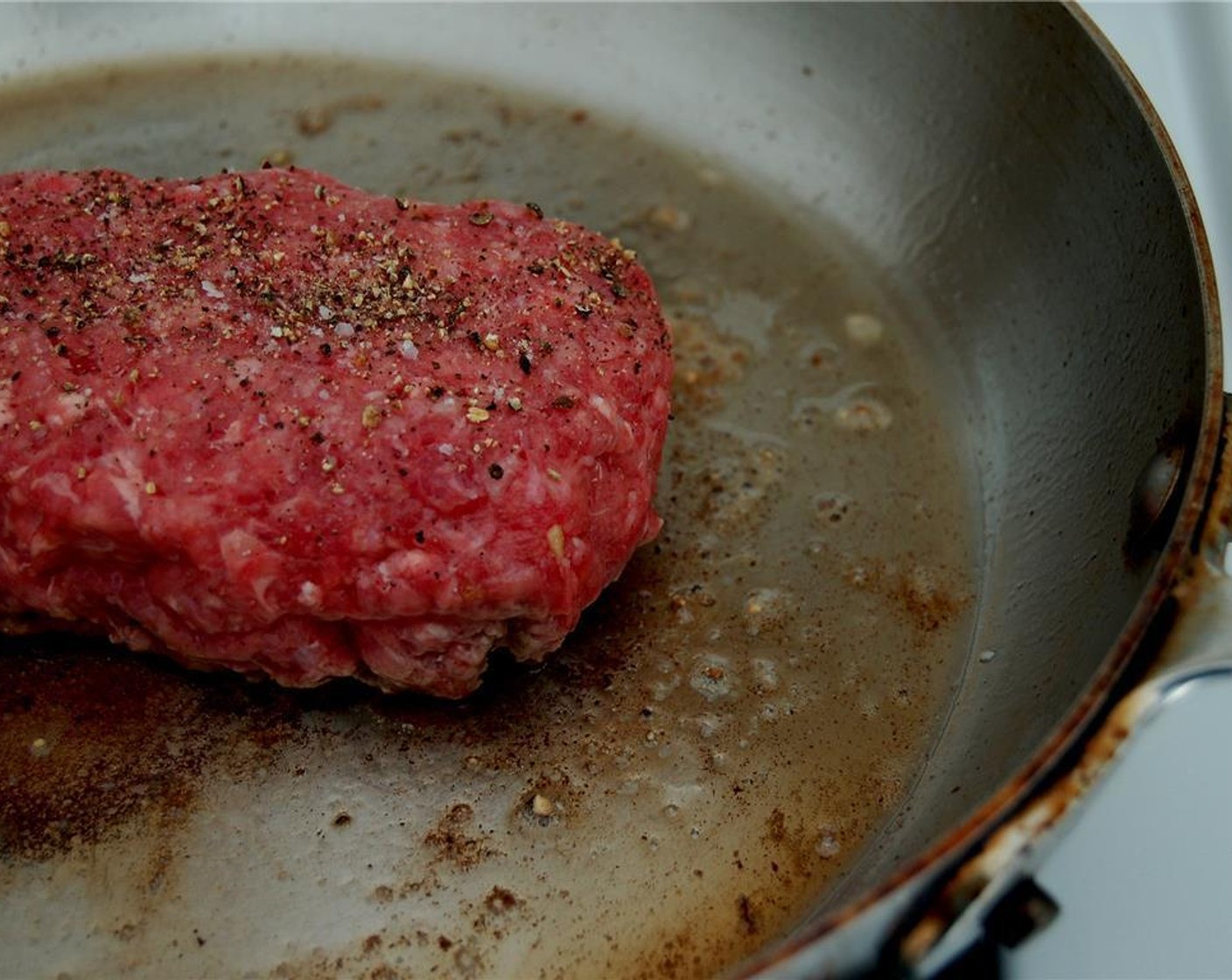 step 1 Make two burger patties out of the Ground Beef (6 oz). Make a well into one of the patties, add the Garlic (1 clove), Blue Cheese (1/2 cup) and Smoked Bacon (2 pieces). Put the second patty on top and seal it.