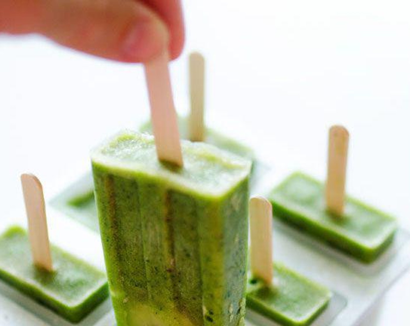step 4 Remove popsicles from the freezer and run the mold under warm water for a few seconds to loosen them up.