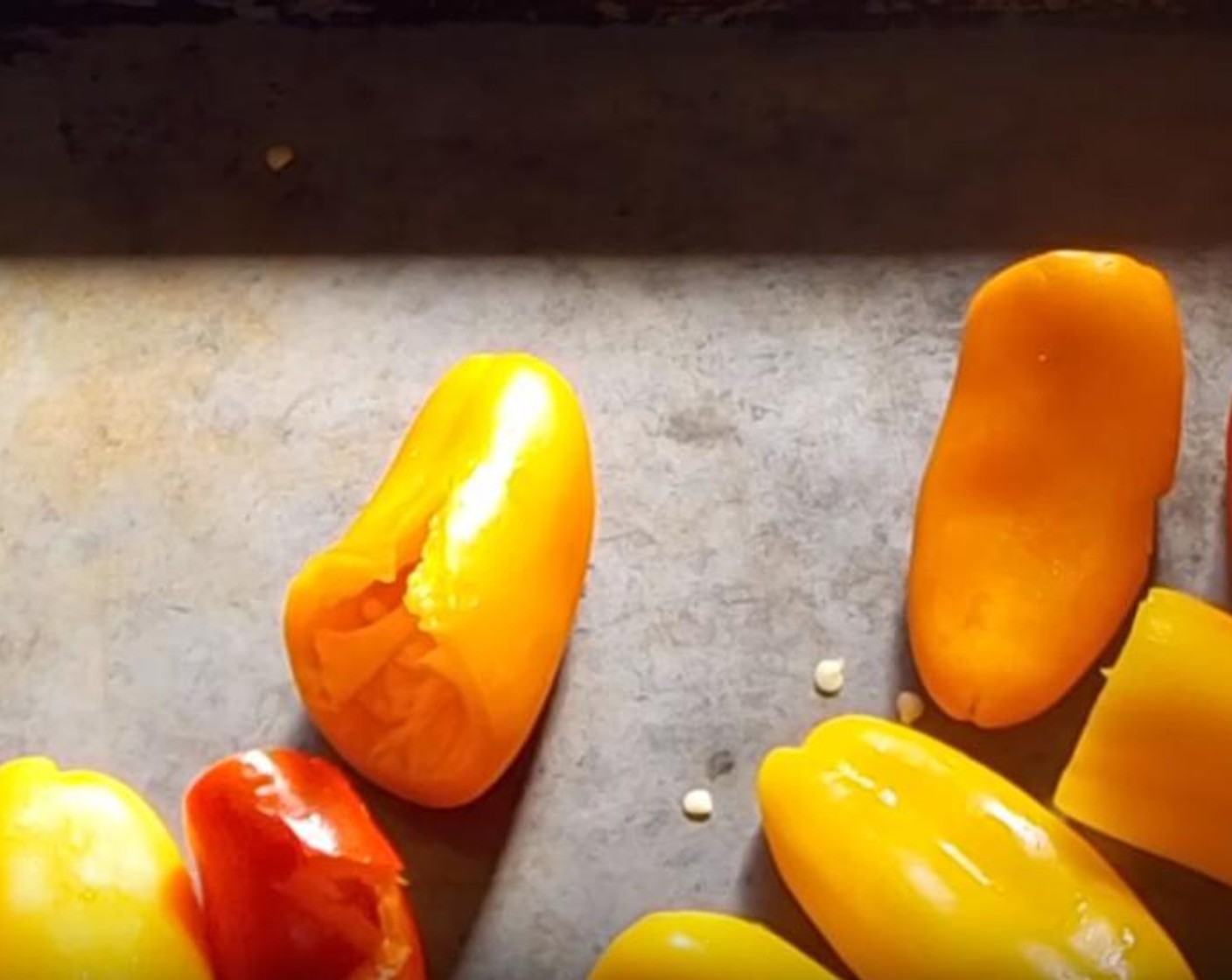 step 2 Remove the tops and insides of Bell Peppers (3). Put them into a pan and drizzle them with Olive Oil (as needed). Put them in the oven preheated to 450 degrees F (230 degrees C) for about 20 to 25 minutes. Rotate them every ten minutes. After done, put them into a bowl and cover them. Let them sit for fifteen minutes.