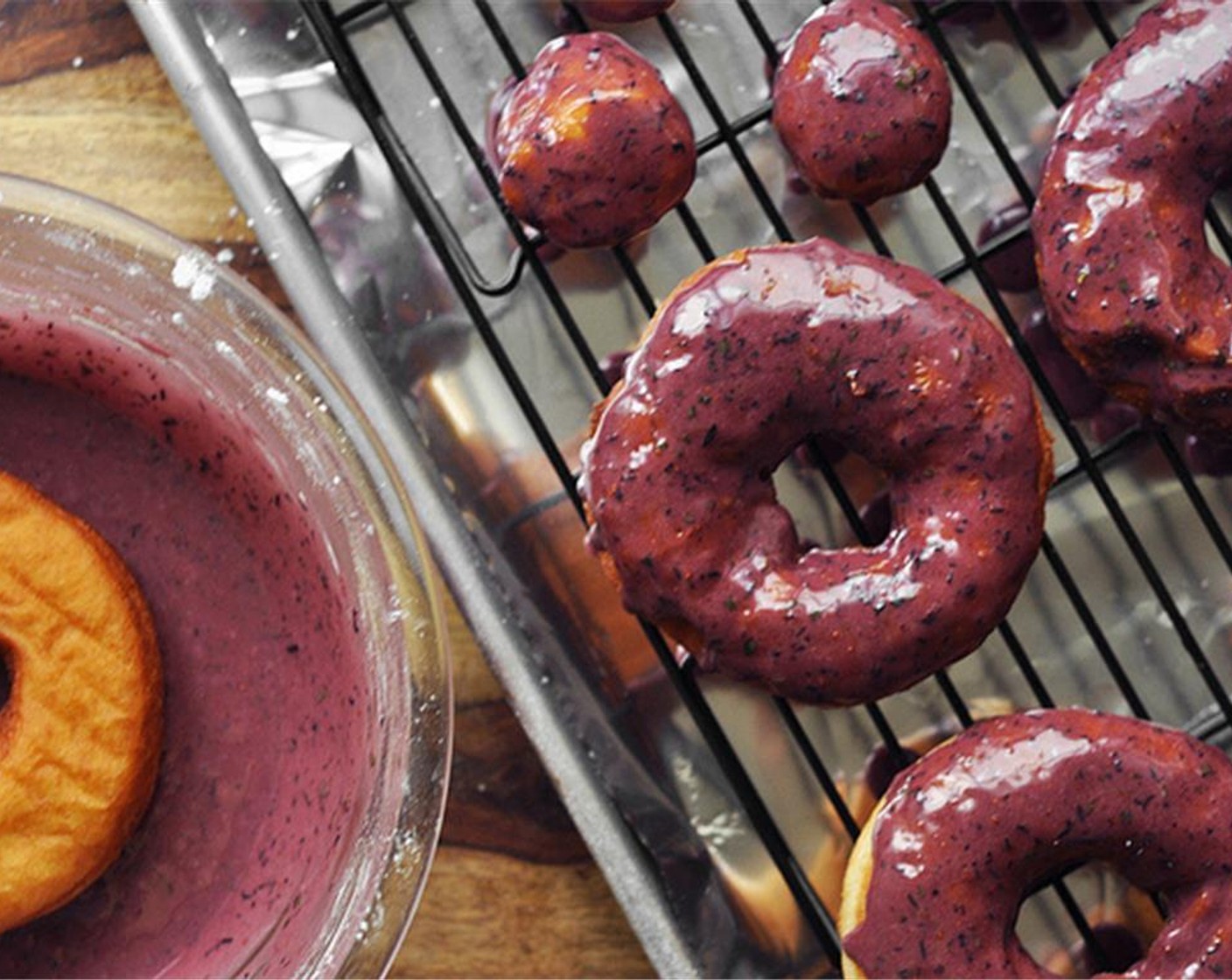 step 14 Dip the doughnuts into the glaze and place on a cooling rack, allowing the glaze to set before eating. Enjoy!