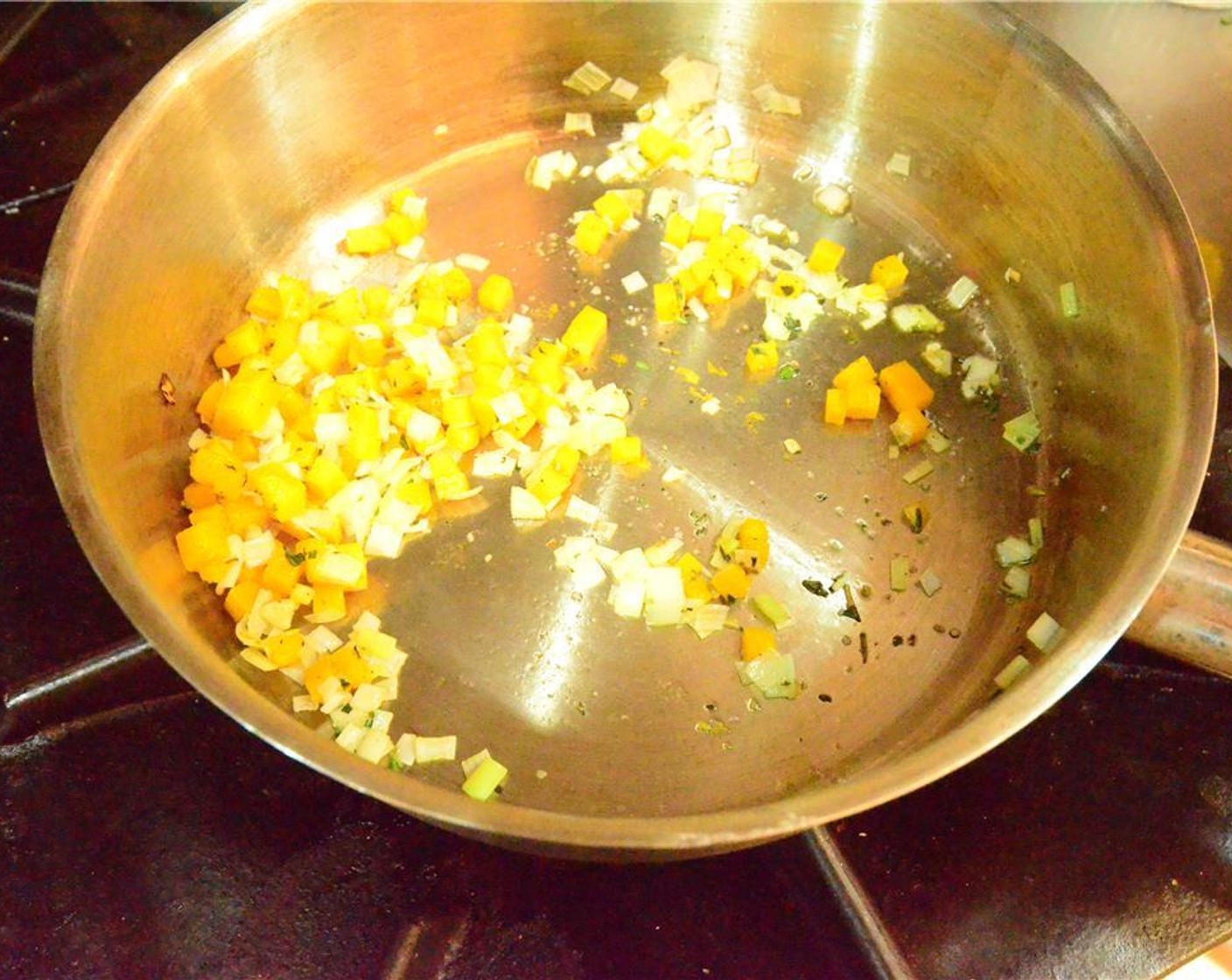 step 8 For the pumpkin blossom stuffing, sweat the Pumpkins (2 2/3 Tbsp) with Leeks (1 2/3 Tbsp) and Shallot (1 Tbsp) in Extra-Virgin Olive Oil (as needed) until tender and allow to cool.