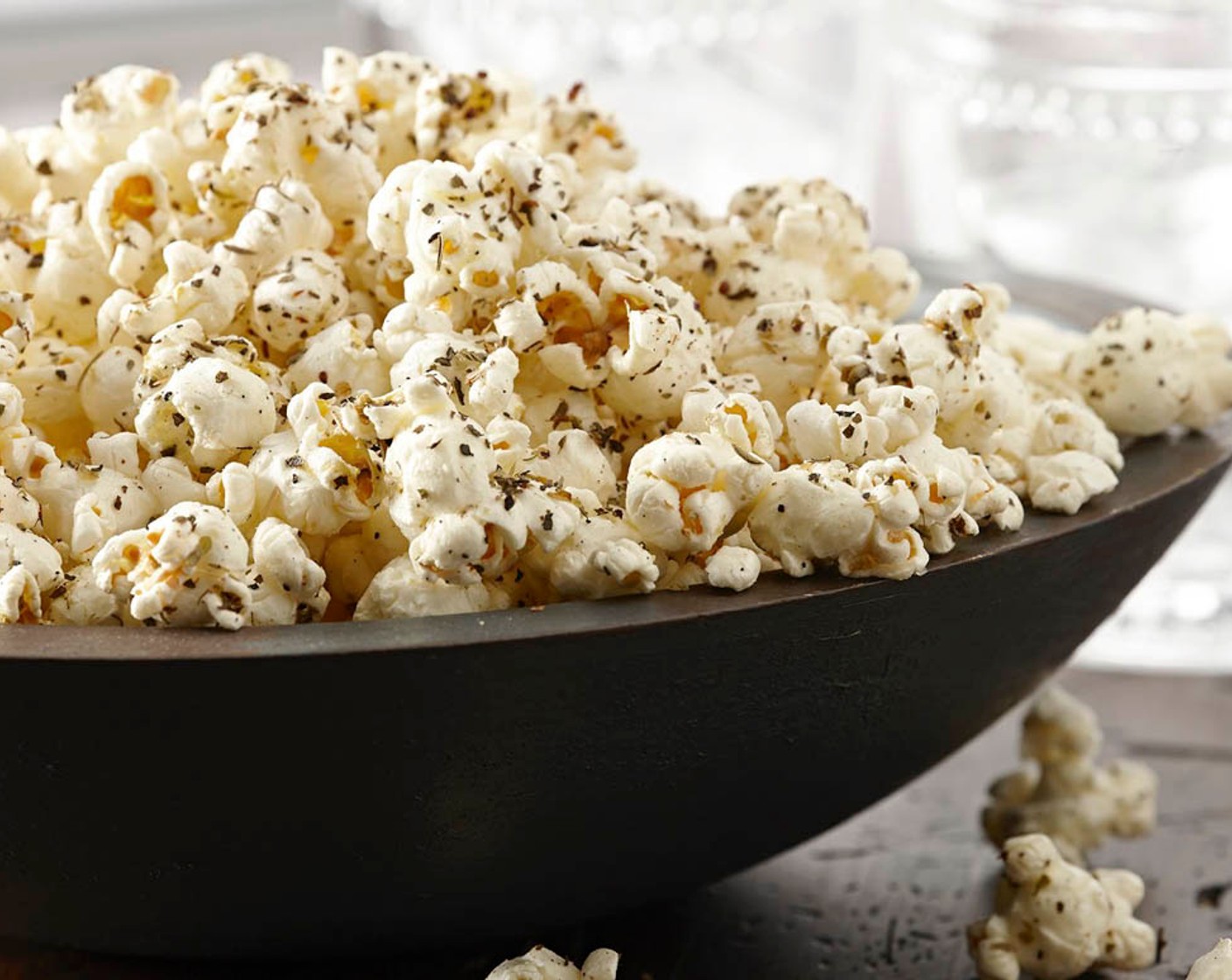 step 1 Mix the Olive Oil (2 Tbsp) and McCormick® Garlic Powder (1/2 tsp), Dried Basil (1 tsp), Dried Oregano (1 tsp), Ground Black Pepper (1/4 tsp), and Sea Salt (1/4 tsp) in a large bowl. Add the Popcorn (12 cups) and toss to coat evenly.