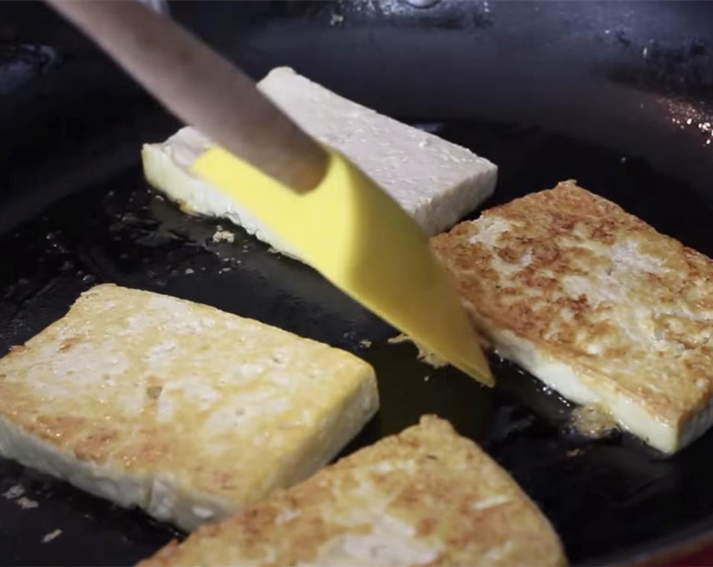 step 9 Flip the tofu over to brown the other side.