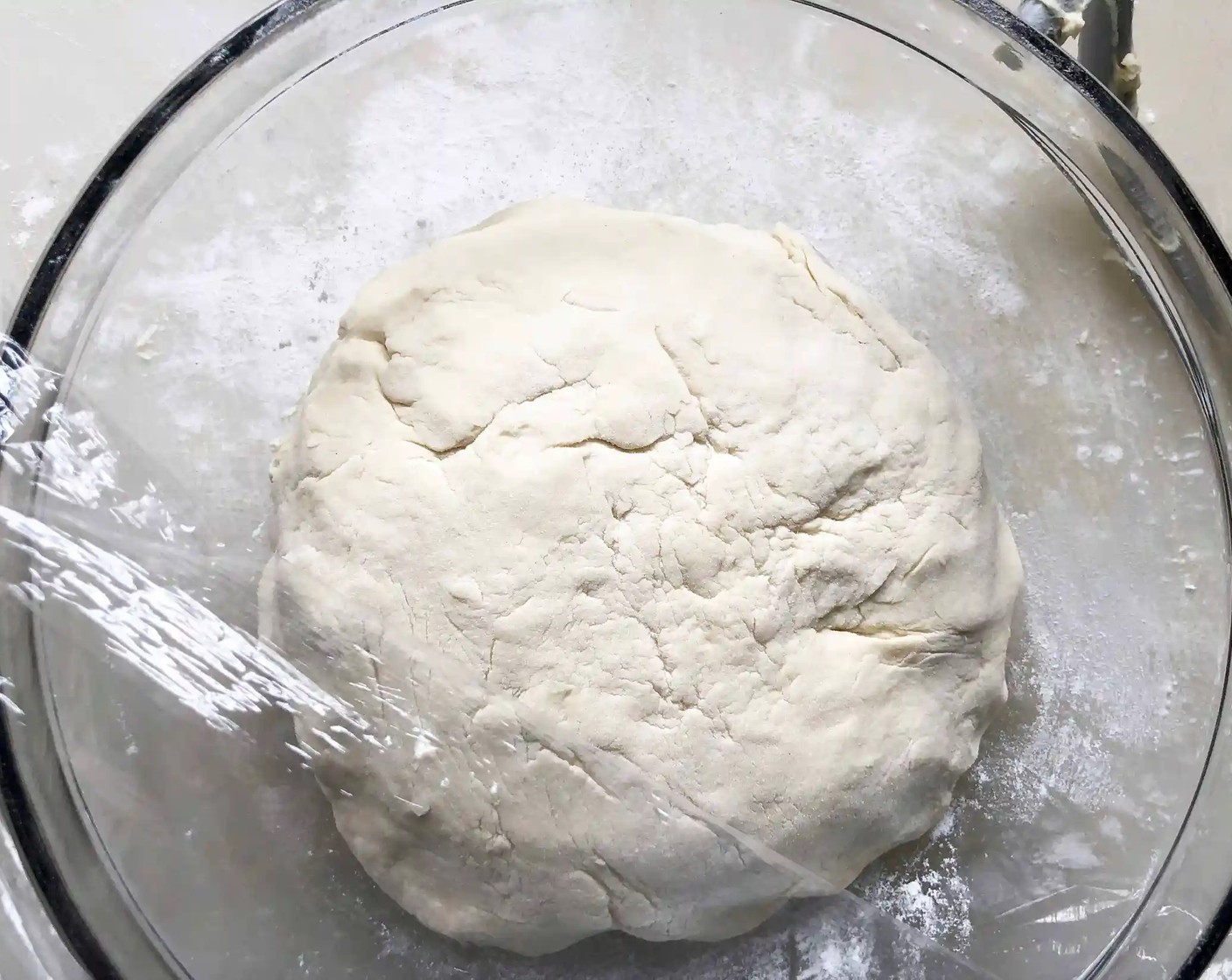 step 5 With floured hands, knead the dough into a ball. Cover the bowl with plastic wrap and let sit in a warm place for 1 hour, until doubled in size, or if not using right away, overnight in the fridge.