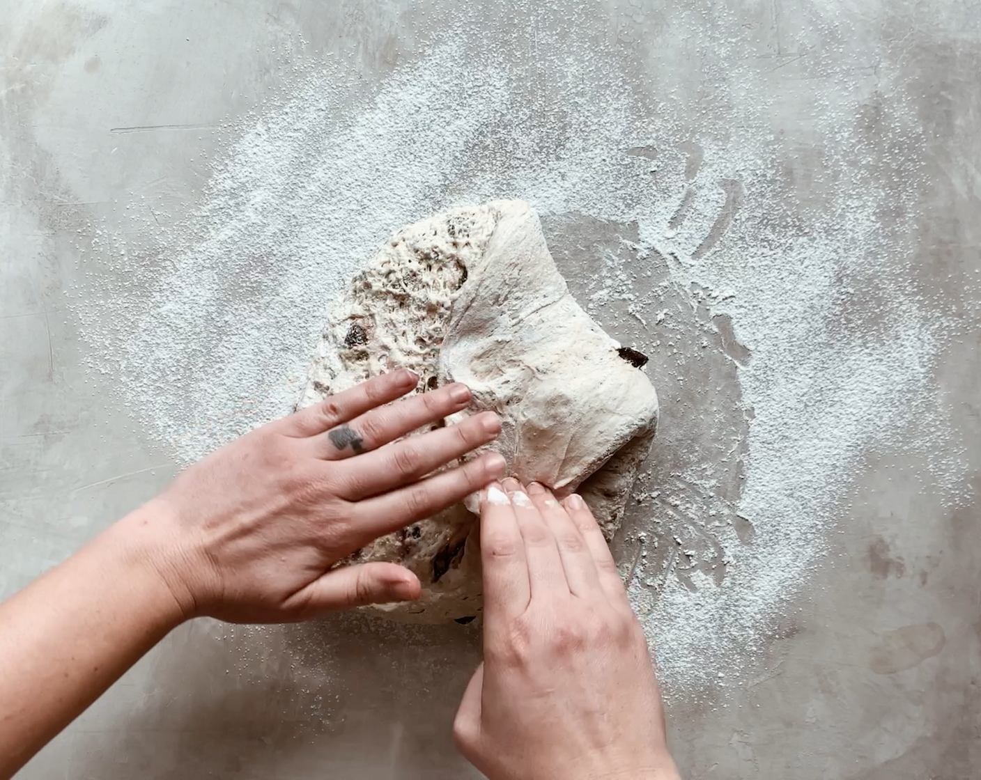 step 8 Lightly sprinkle the top of the dough with flour, and gently fold the edges of the dough toward the center, overlapping each flap of dough with the following fold.