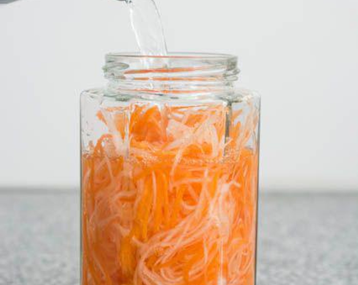 step 1 Make the pickled carrot and radish: Place the Carrot (1 cup) and Daikon Radish (1 cup) in a jar. Fill the jar with Distilled White Vinegar (1 cup), Water (3/4 cup), and Granulated Sugar (4 Tbsp).