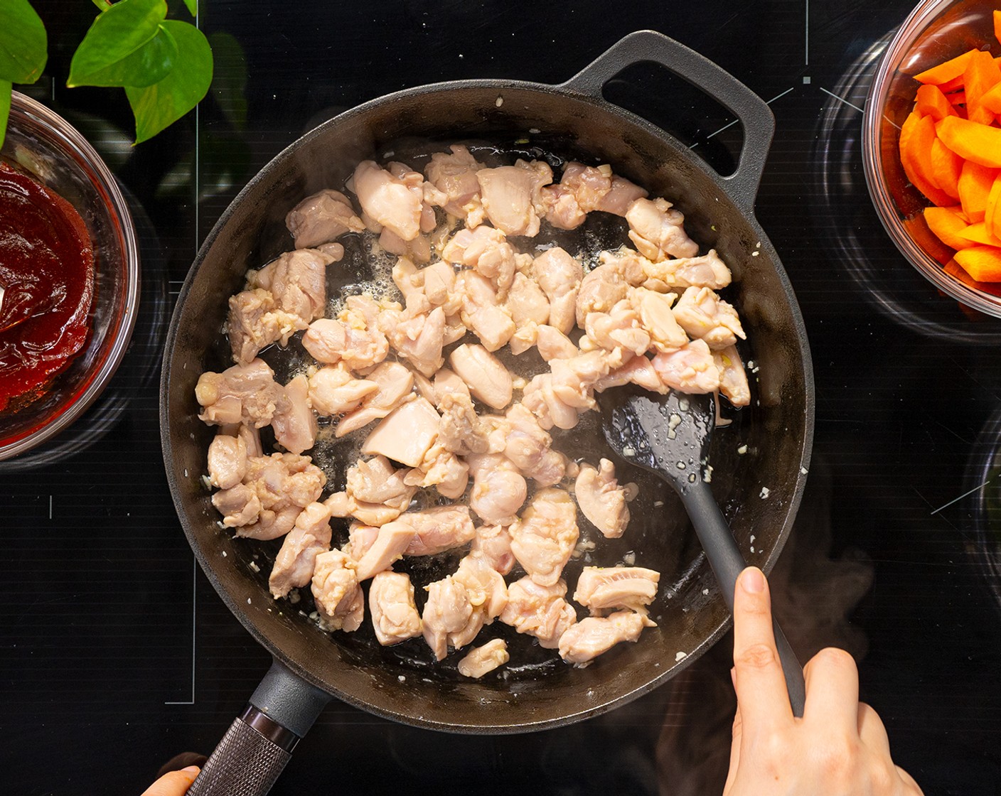 step 4 In a wok or large skillet over medium-high heat, add Vegetable Oil (1/2 Tbsp). Once hot, add Garlic (2 cloves) and cook until fragrant. Then add chicken thighs and cook for 2-3 minutes.