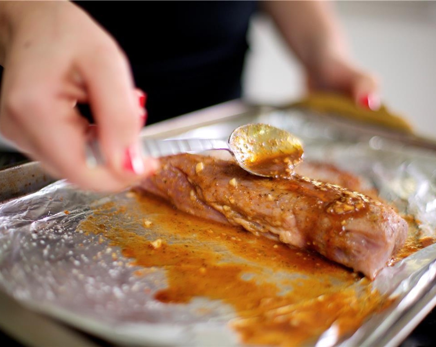 step 7 Pat the Pork Tenderloin (1) dry with paper towels. Place it on another sheet pan and season with Salt (1/2 tsp) and Ground Black Pepper (1/4 tsp) evenly over pork on all sides. Apply a generous coating of the glaze to the tenderloin with a spoon and roast ten minutes.