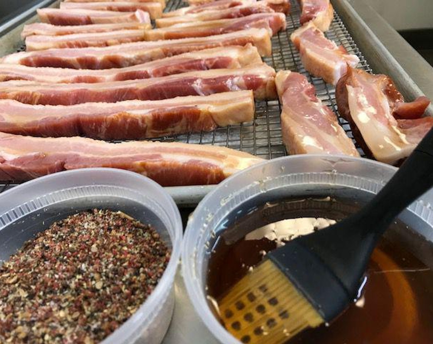 step 5 Slather both sides of bacon with maple and honey mixture. Generously sprinkle the spice mixture over the bacon to ensure even layering.