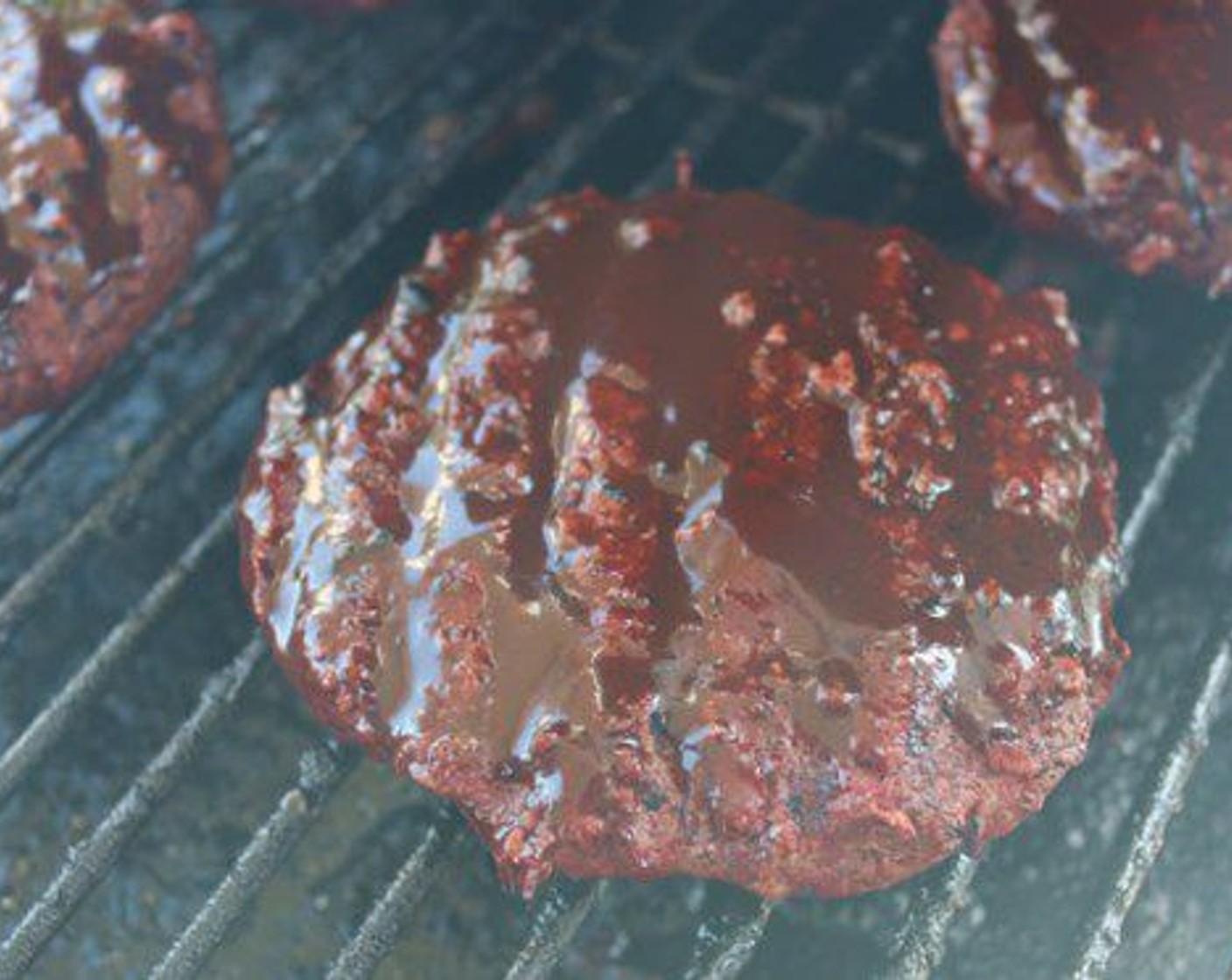 step 10 Flip burgers and continue to cook until internal temperature reaches 140 degrees F (60 degrees C). Brush Steak Sauce on top of each burger and cook for 1-2 minutes.