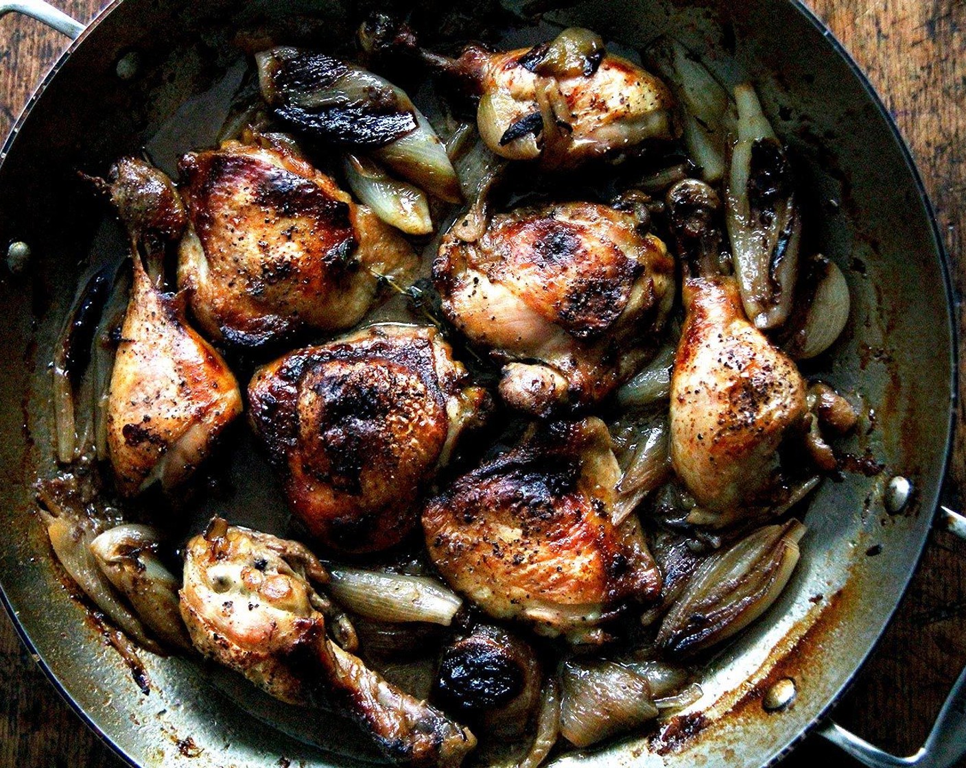 step 7 Return the juices, chicken and shallots to the pan. Return to the oven or bring to a simmer stove top to reheat. If chicken isn't as brown as you would like, you can stick it under the broiler too. Serve immediately with crusty bread and a salad.