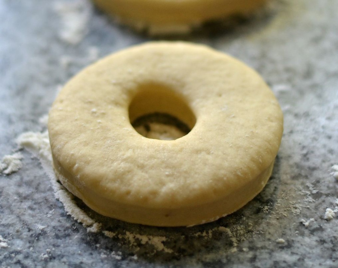 step 5 Cover donuts with a towel and let them rise for around 15 minutes.