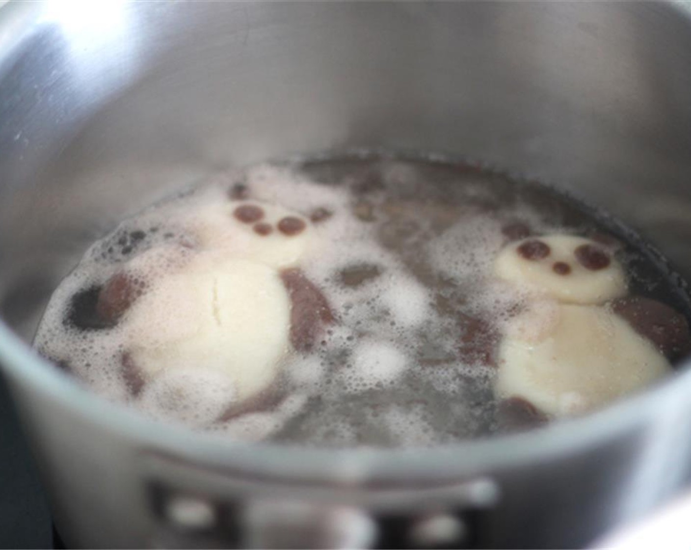 step 5 Toss the pandas gently in a boiling water with a low heat, and cook them till they float, about 10 minutes.