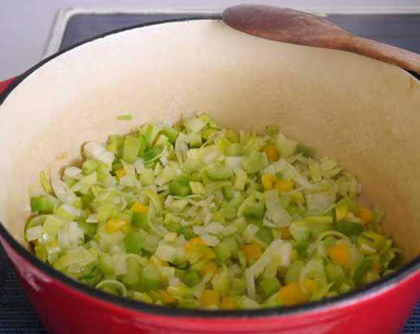 step 1 In a hot pot add the Extra-Virgin Olive Oil (4 Tbsp), Onion (1), Garlic (3 cloves), Leek (1/2), Celery (2 stalks), and Yellow Bell Pepper (1/2), stir and leave to cook for 10 min approx at a medium temperature. After 10 minutes add the Carrots (2) and Green Bell Pepper (1/2), stir and leave to cook for 5 minutes.