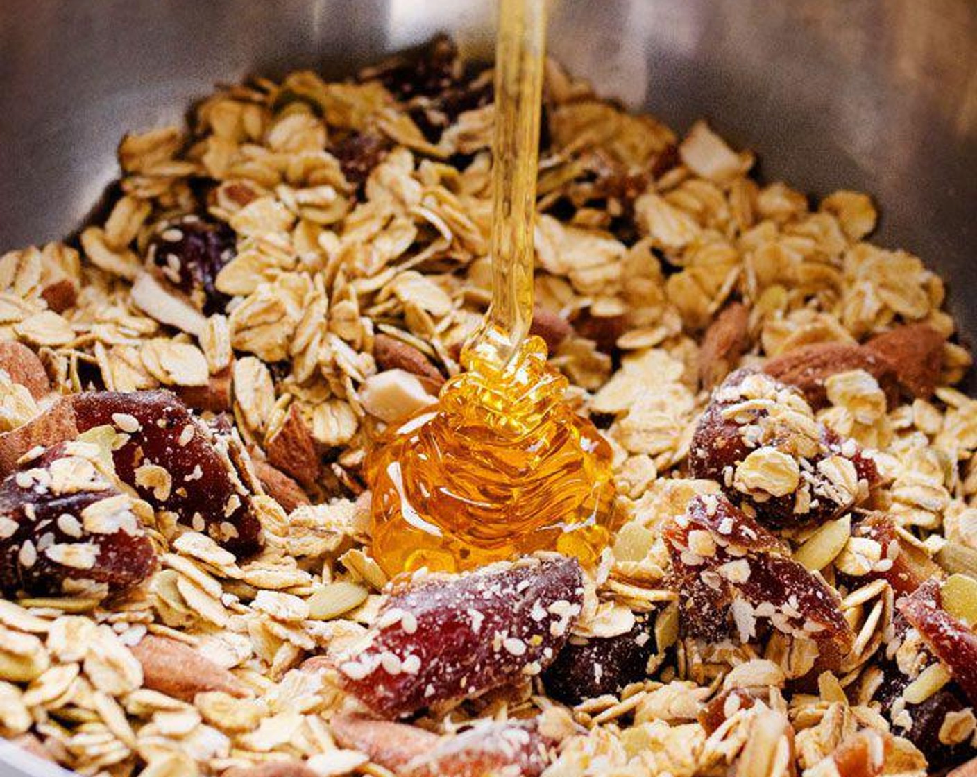 step 2 Combine Old Fashioned Rolled Oats (3 cups), Pepitas (3 Tbsp), Sesame Seeds (3 Tbsp), Medjool Dates (1 cup), Honey (1/2 cup), Almonds (1/2 cup) and Sea Salt (1/4 tsp) in a large bowl.