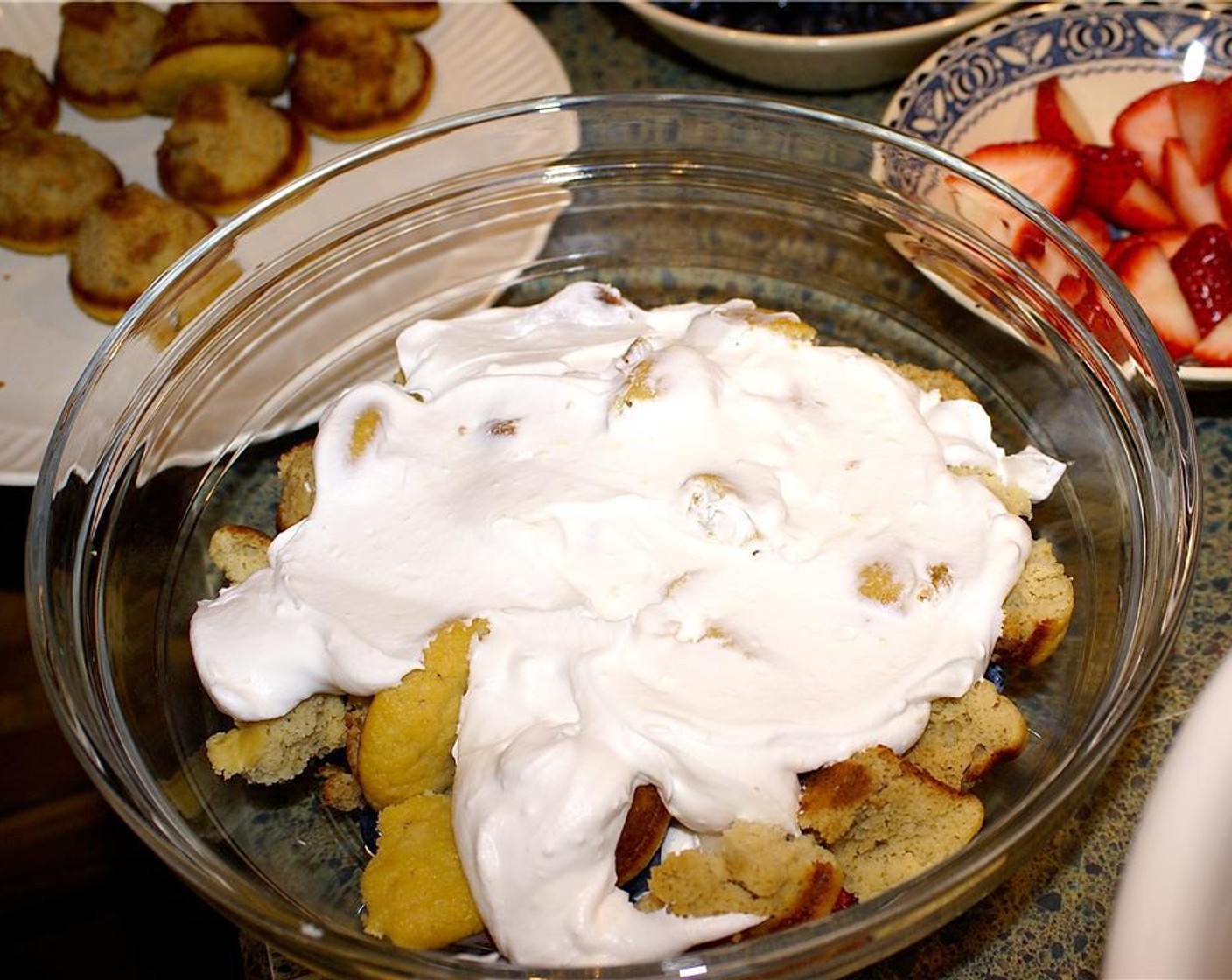 step 6 To assemble, place about half of the cake in a large bowl. Top with half of the whipped cream and half of the Fresh Mixed Berries (2 cups).