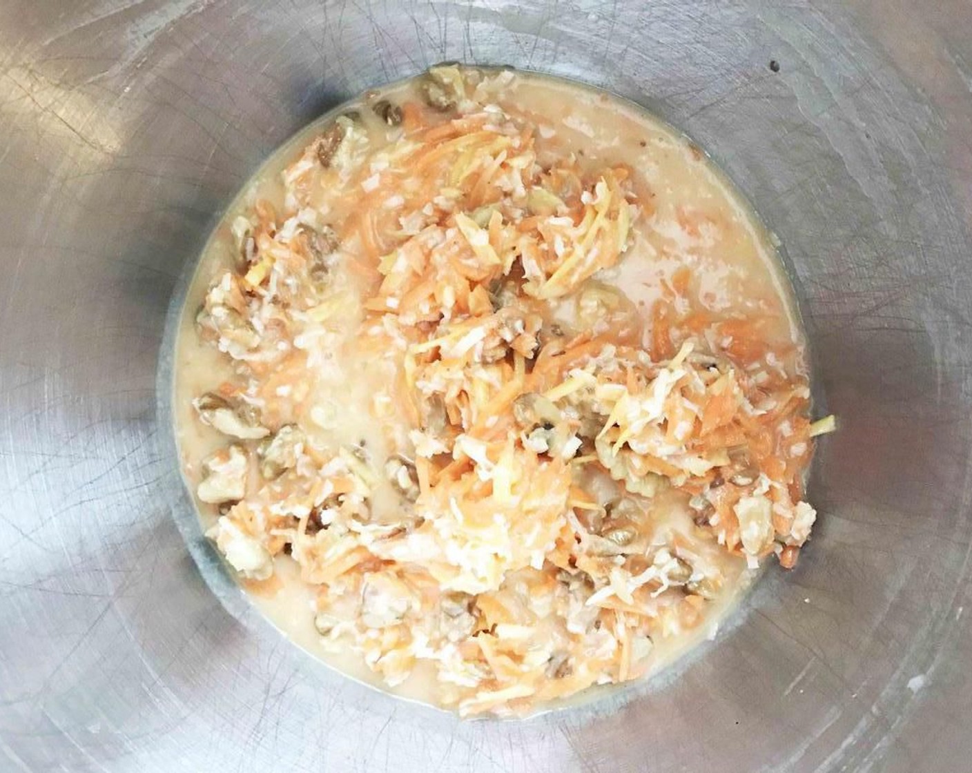 step 3 Add in the Carrots (2 cups), Walnut (1 cup), Unsweetened Coconut Flakes (1 cup), Sun-Maid Raisins (1 cup), and Crushed Pineapple in 100% Pineapple Juice (1 cup). Stir to combine.