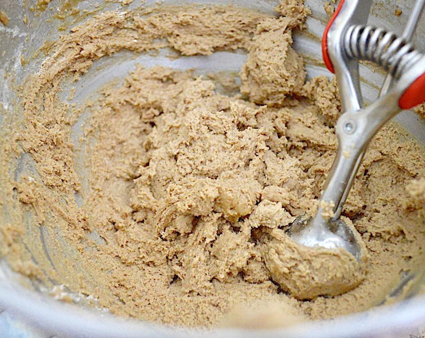 step 5 Once they are mixed in reduce the speed to low and slowly add in the flour mixture until you have a soft cookie dough.