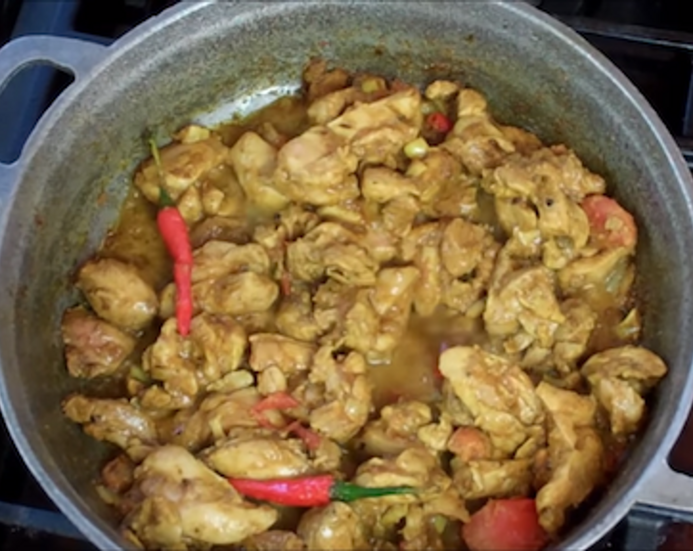 step 5 Turn the heat up to medium-high and start adding the seasoned chicken (it’s ok if the tomato goes in) – stir well to pick up all the curry goodness from the bottom of the pot and to coat the chicken pieces. Stir well and cook uncovered for 4-5 minutes.