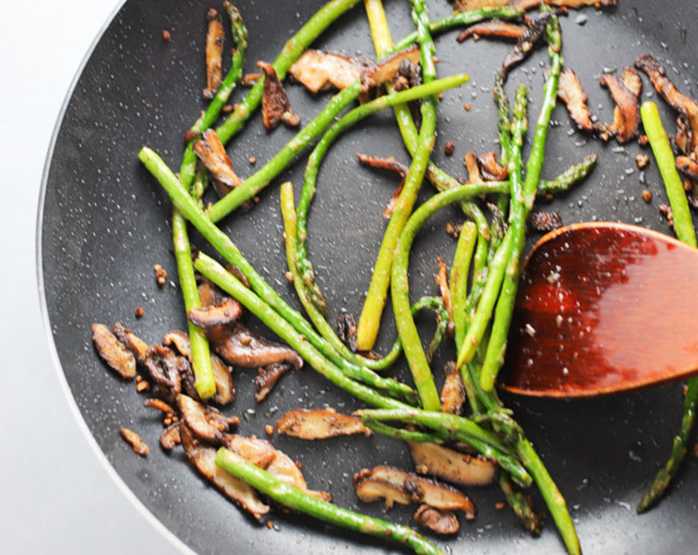 step 2 Put Extra-Virgin Olive Oil (2 Tbsp) in frying pan on medium-high heat. Saute Asparagus (1 handful), Shiitake Mushroom (1 cup), Garlic (1 tsp), Salt (1/4 tsp), and Ground Black Pepper (1/4 tsp) until soft, for about 8 minutes. Remove from heat.