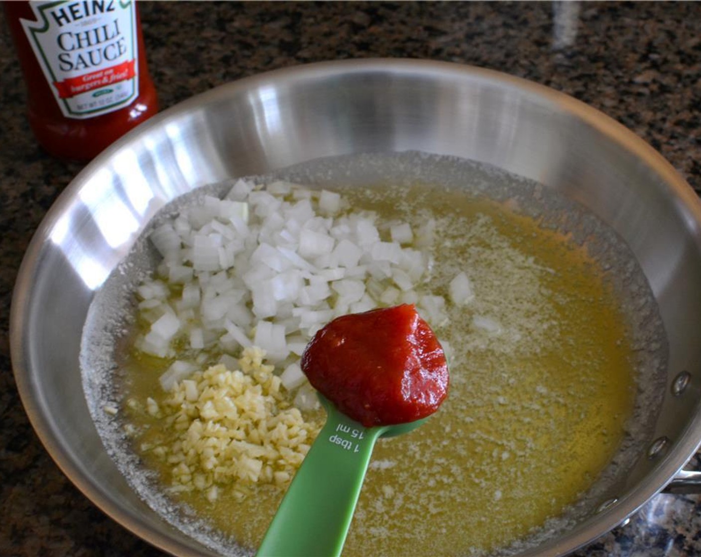 step 2 Add Onion (1/2 cup), Garlic (4 cloves), Chili Sauce (2 Tbsp), Worcestershire Sauce (1 Tbsp), Tomato Paste (1 Tbsp), Smoked Paprika (1 tsp), Dried Oregano (1 tsp), Cayenne Pepper (1/2 tsp), Tabasco® Original Red Pepper Sauce (1 tsp), Liquid Smoke (1/2 tsp) and juice from Lemon (1).