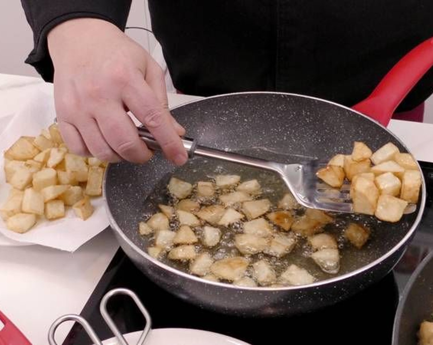step 7 Once fried to a golden brown color, remove and place on a plate with paper towels to dry the excess oil.