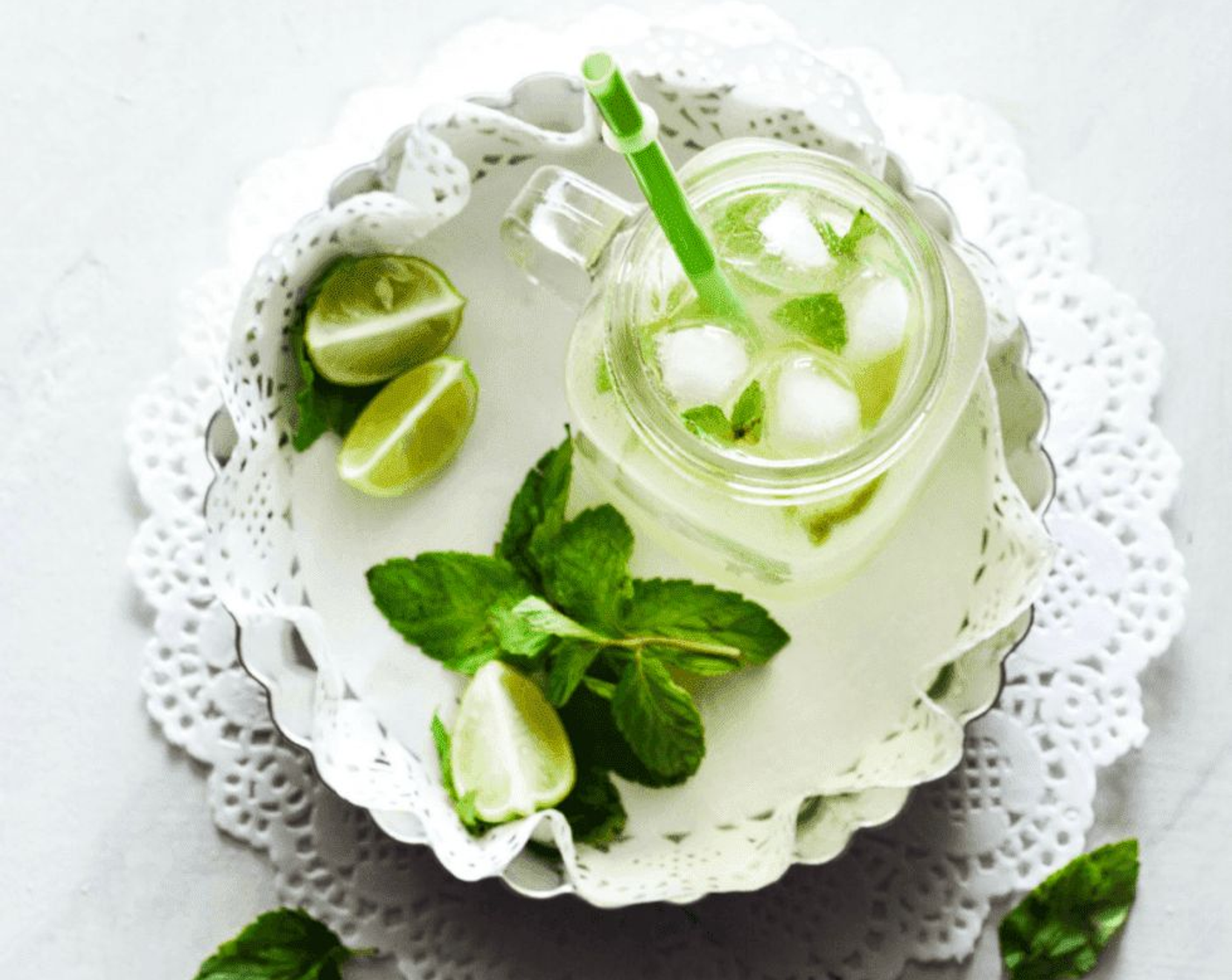 step 3 Take serving glass and add Ice (1 handful). Pour in the shikanji in the glass and add some Fresh Mint Leaves (3) on top.