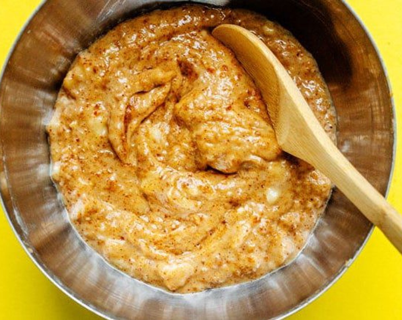 step 4 In a large bowl, use a potato masher to combine date mixture with Almond Butter (4 Tbsp), Vegetable Oil (4 Tbsp), Brown Sugar (4 Tbsp), Simply Organic Vanilla Extract (1 tsp), and Bananas (3).