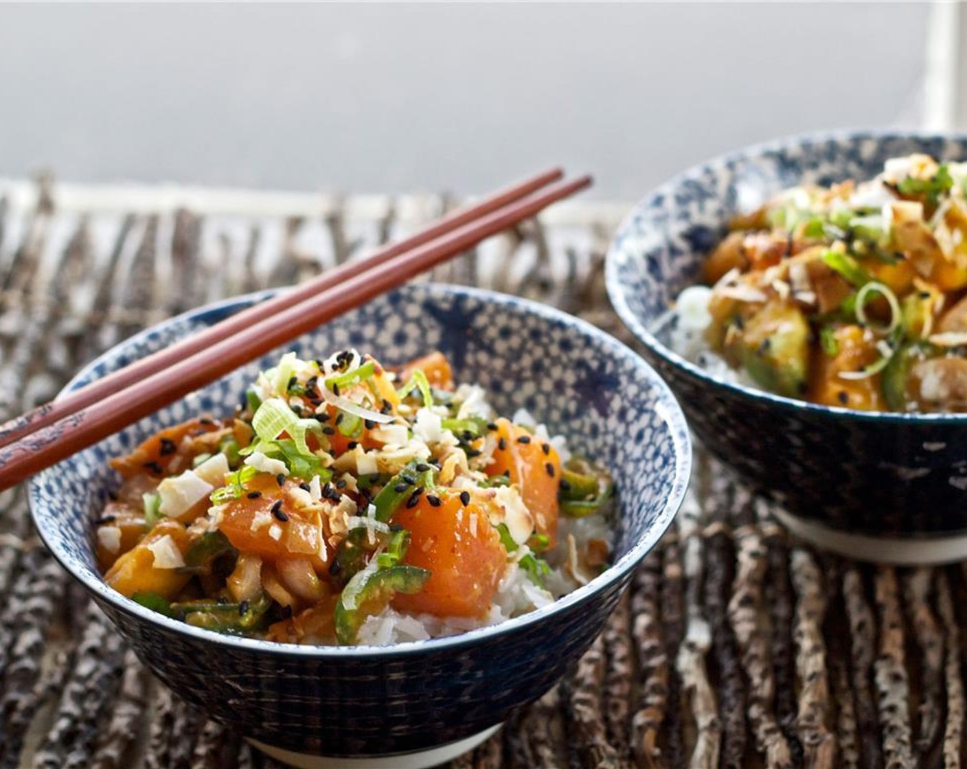 step 6 Assemble the poke bowls with a bed of rice, a scoop of salmon poke, and then garnish with coconut flakes, Black Sesame Seeds (to taste), and Scallions (to taste). Enjoy!