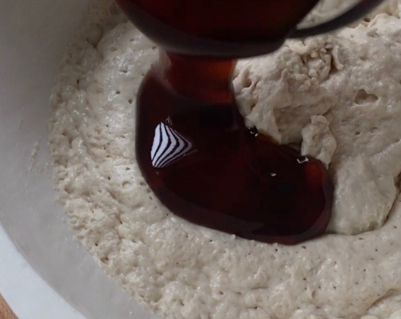 step 13 In a mixing bowl, add palm sugar syrup and flour mixture into the fermented yeast mixture.