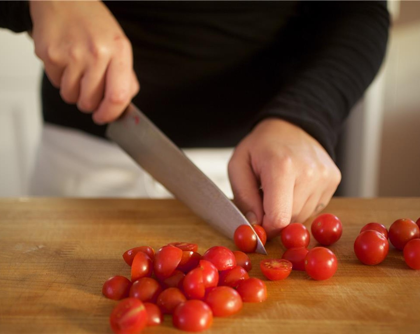 step 2 Cut Garlic (2 cloves) into quarter inch slices lengthwise, and set aside. Slice Cherry Tomato (1 cup) in half, and set aside. In a small bowl, mix together one cup of water and Chicken Base (1 pckg).