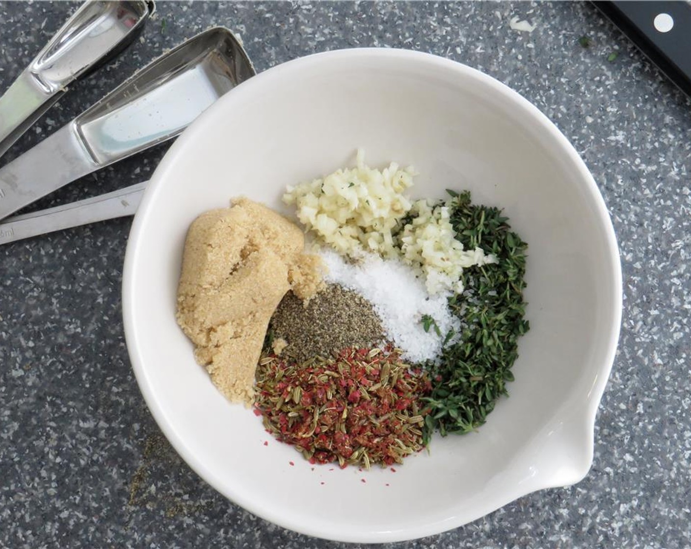 step 1 In a small bowl, combine the whole Red Peppercorns (1 tsp), Fennel Seeds (1 tsp), Ground Black Pepper (1 tsp), Kosher Salt (1 tsp), Fresh Rosemary (1 Tbsp), Fresh Thyme (1 Tbsp), Garlic (2 cloves), and Brown Sugar (1 1/2 Tbsp).