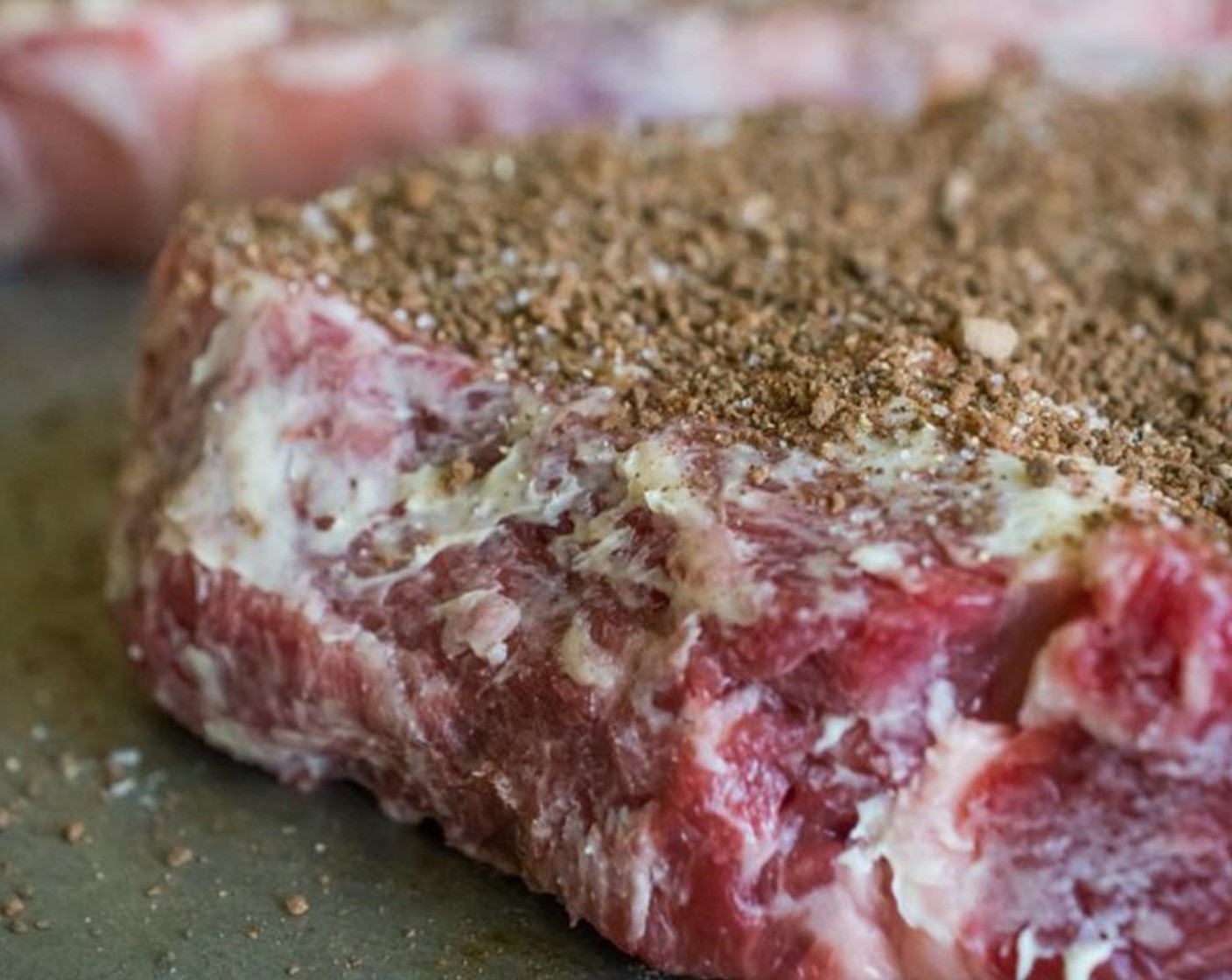 step 3 Smear Unsalted Butter (2 Tbsp) all over the steaks, then rub in generous amounts of coffee dry rub on each side of the steaks.