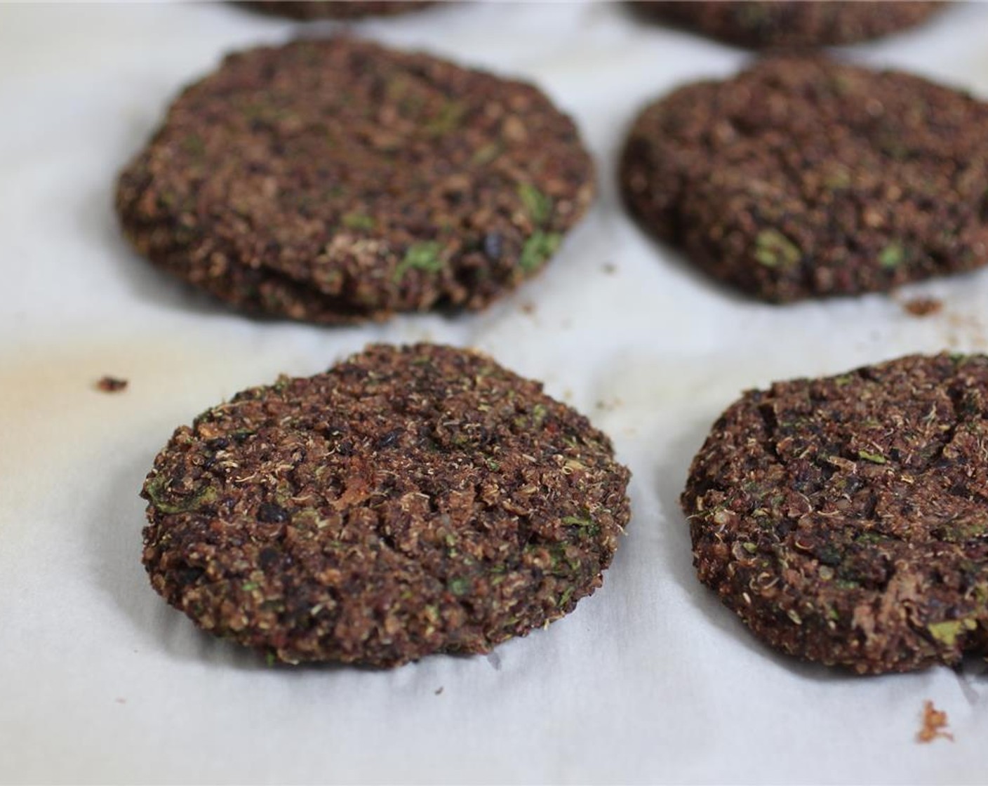 step 5 Place the burgers on a baking sheet covered with parchment paper and bake for 15 minutes on each side, or until the outsides begin to get a bit crispy and the burgers are firm.