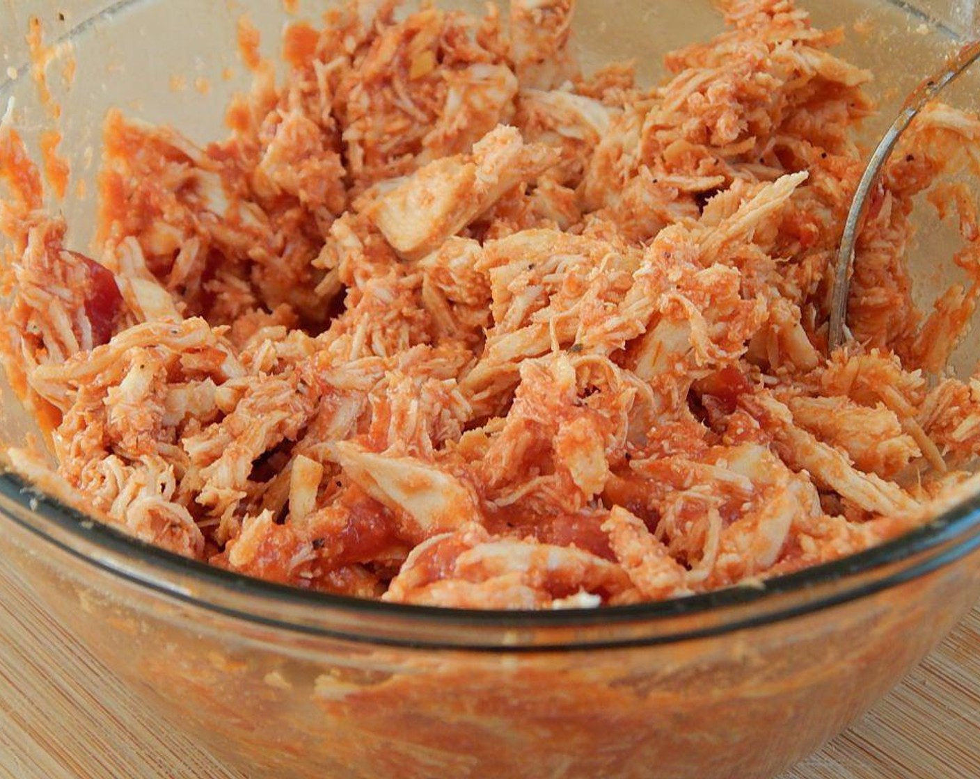 step 5 In a bowl, mix Chicken (12 oz) with the remaining pasta sauce.