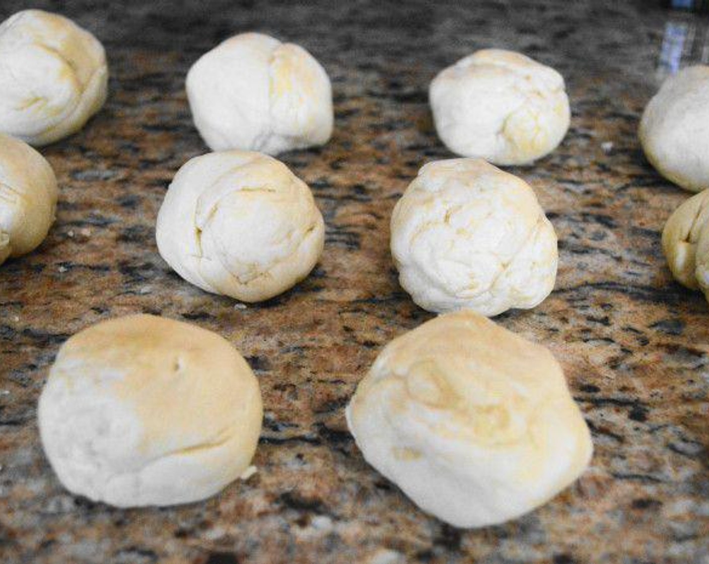 step 5 Once it has rested, divide the dough into 12 equal pieces and roll them into golf-ball sized balls. Use a floured rolling pin to roll each ball out into large, thin enough circles to be taco shells. Stack with parchment paper in between until you are ready to cook them.