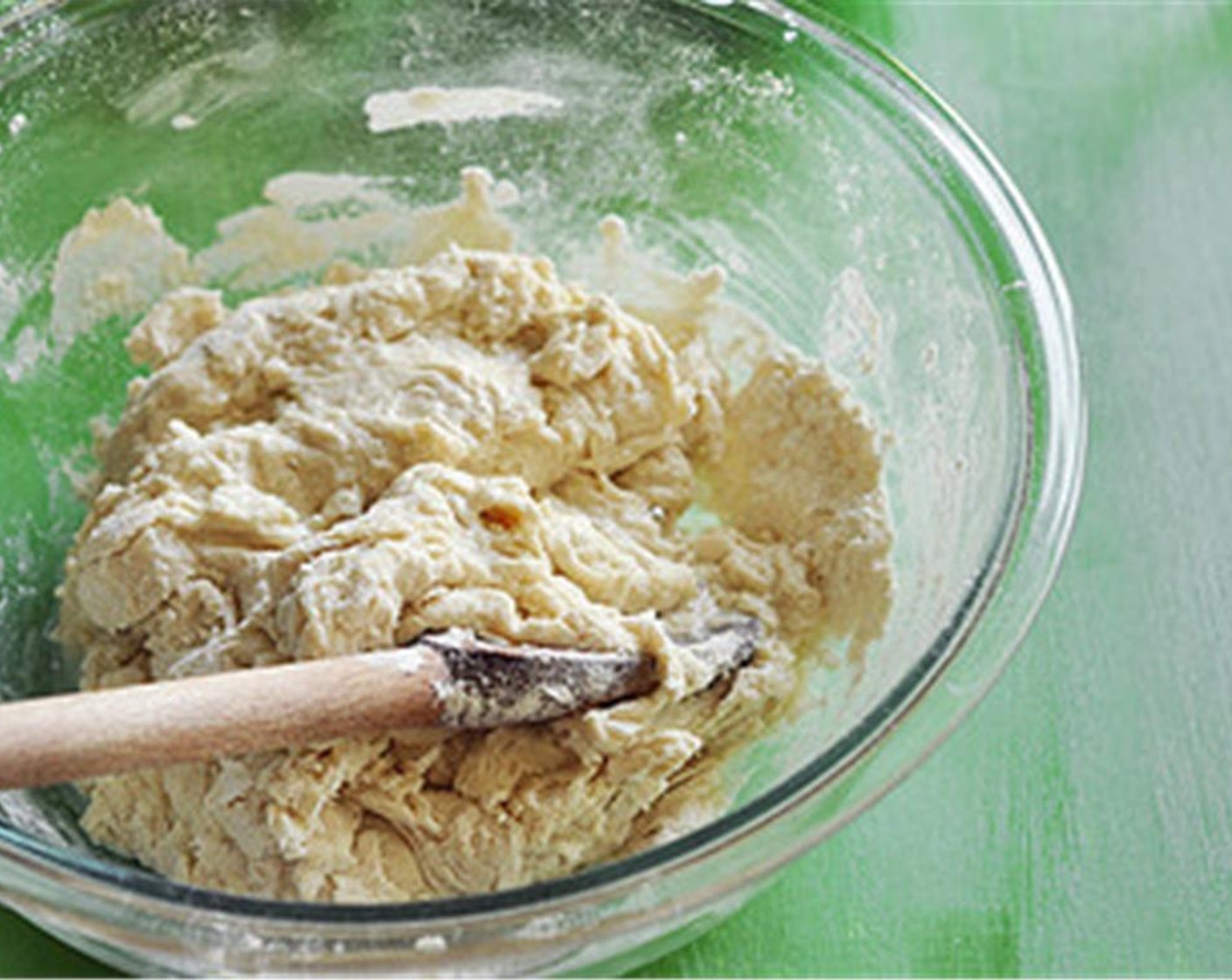 step 2 Mix with a wooden spoon until it comes together into a shaggy dough. Add a bit more water, a little at a time, if the dough is too dry.