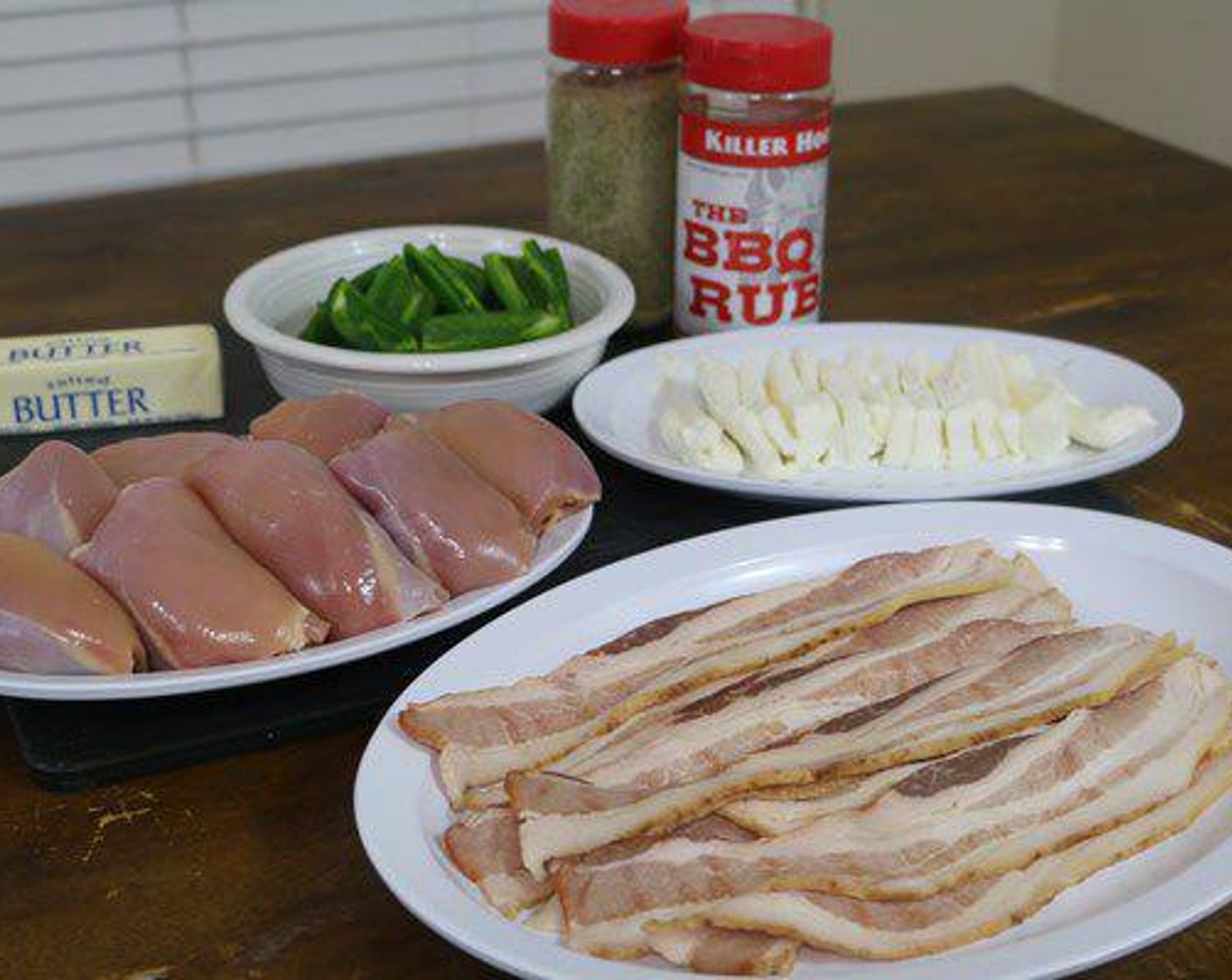 step 1 Remove the Boneless, Skinless Chicken Thighs (8) from the packaging and place on a cutting board designated for poultry.  If there is any excess fat on the thighs go ahead and trim it off.  Season each side with a good dose of All-Purpose Seasoning (to taste).