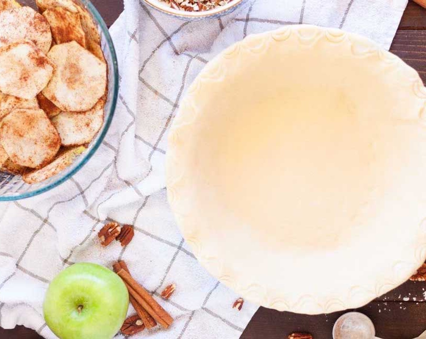 step 6 Place your Pie Crust (1) in a pie pan and get ready to add in your apples.