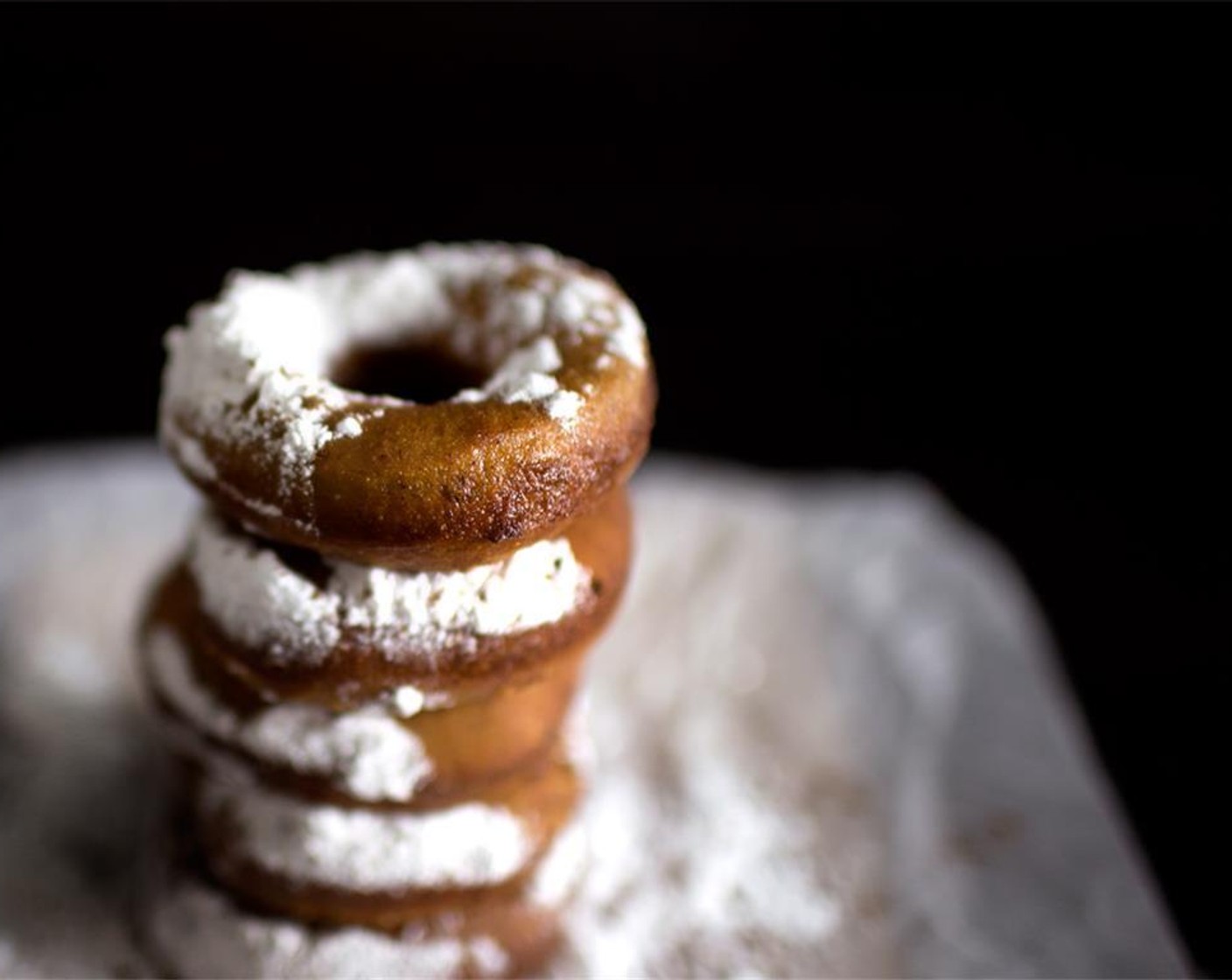 step 11 To serve, mix Powdered Confectioners Sugar (1/2 cup) together with Ground Allspice (1 tsp) and spoon generously over the warm donuts.