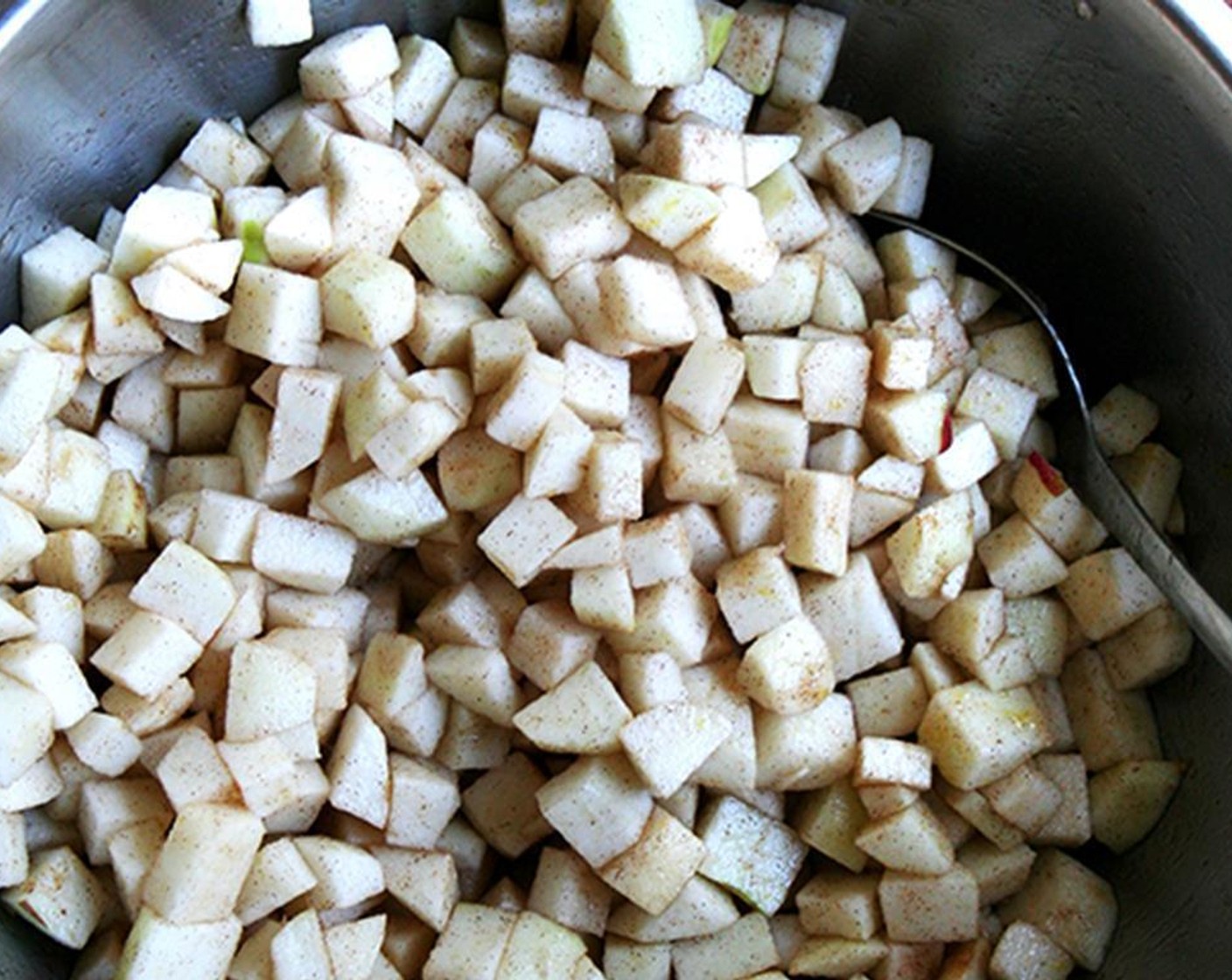 step 6 Peel the Apples (10) and cut into large chunks. Place in a large bowl and toss with Granulated Sugar (3/4 cup), Ground Cinnamon (1 tsp), Whole Cloves (to taste), the zest of Lemon (1), juice from the Lemon (1), and the Instant Tapioca (2 Tbsp). Set aside.