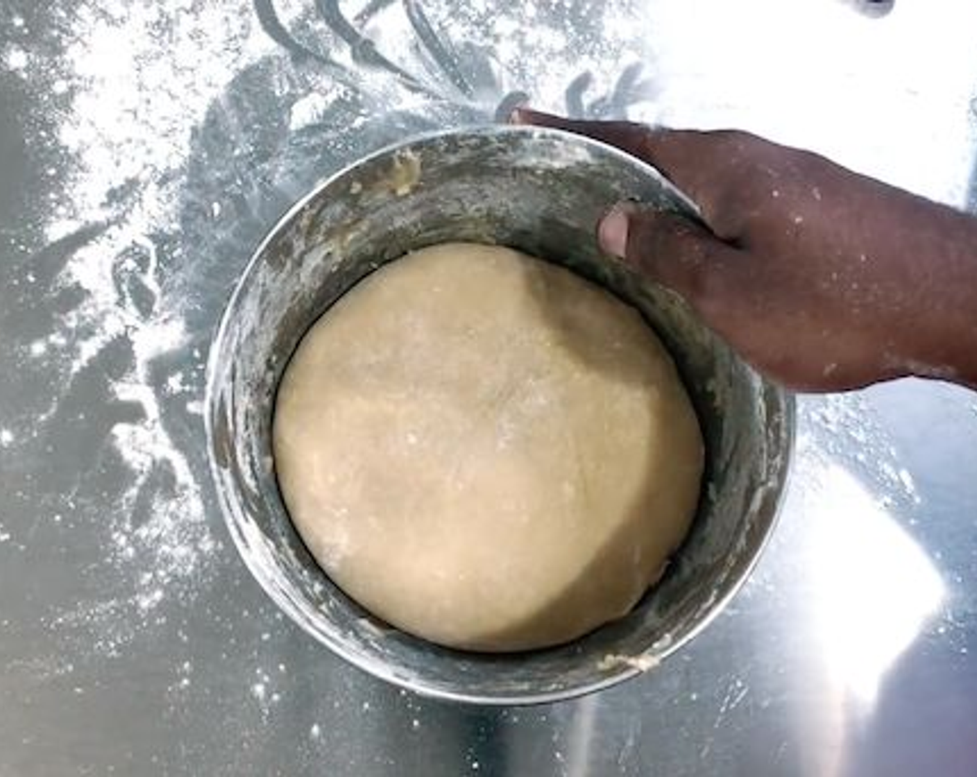step 6 Remove the dough. It should be sticky but should not stick completely to your hand. Flour your surface and knead the dough a few times. You should be to press on the dough and have it spring back. Place the dough in a bowl, cover, and let it rise for about 1 1/2 hours.