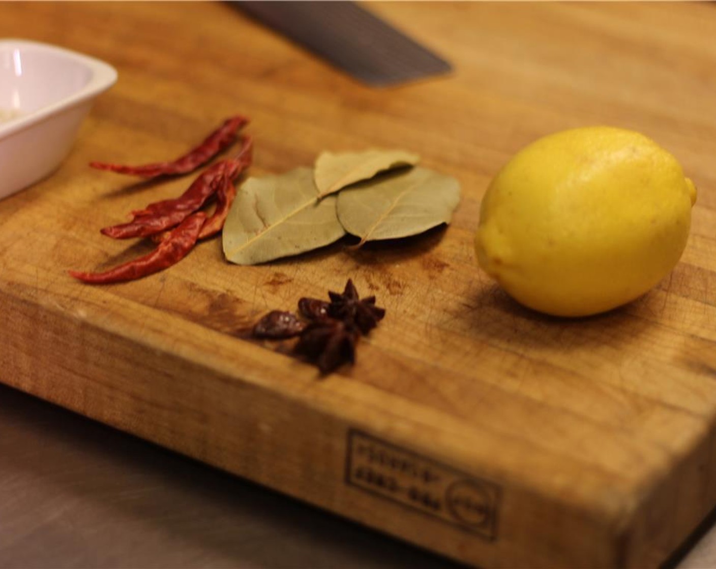 step 1 Prepare the Lemon (1), Bay Leaves (4), Dried Chili Peppers (3) and Star Anise (2).
