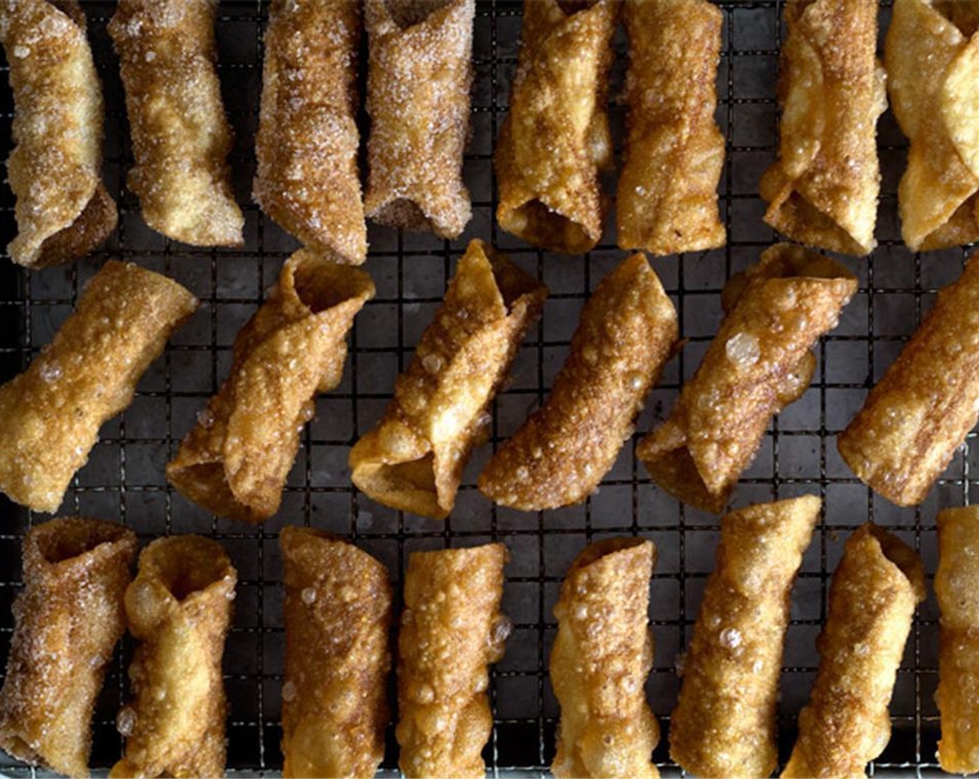 step 6 Let the shells drain and cool on a cooling-rack. Mix Granulated Sugar (4 Tbsp) and Simply Organic Cinnamon, Ground (1 tsp). Then roll the shells in the cinnamon sugar to coat. Set aside.