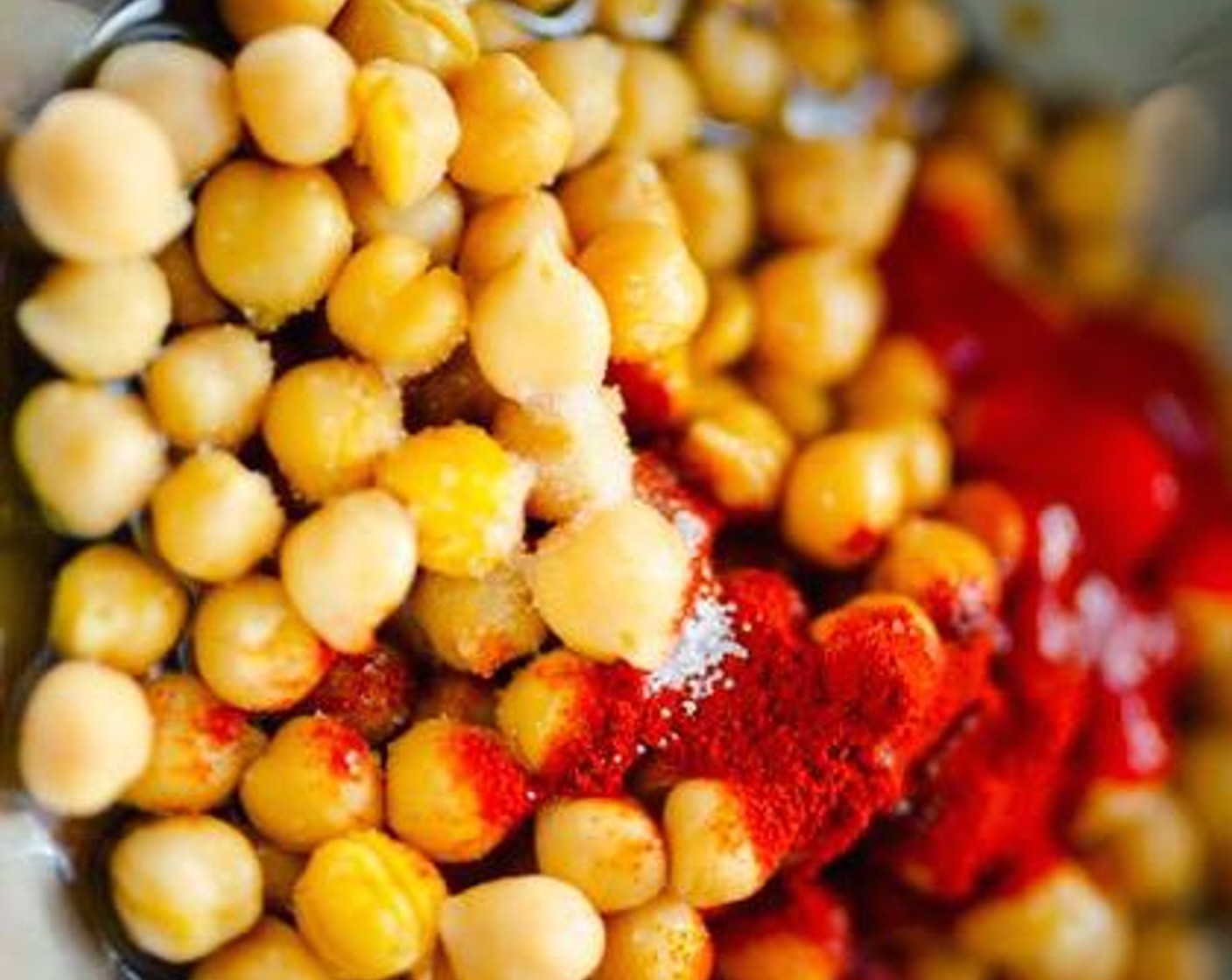 step 2 Pat dry Chickpeas (1 can) with paper towels then mix with Olive Oil (1 Tbsp), Tamari Soy Sauce (1 Tbsp), Sriracha (1/2 Tbsp), Maple Syrup (1 tsp), Smoked Paprika (1/2 tsp), Salt (1/4 tsp) and Ground Black Pepper (1/4 tsp). Spread onto half of a parchment paper-lined baking sheet.
