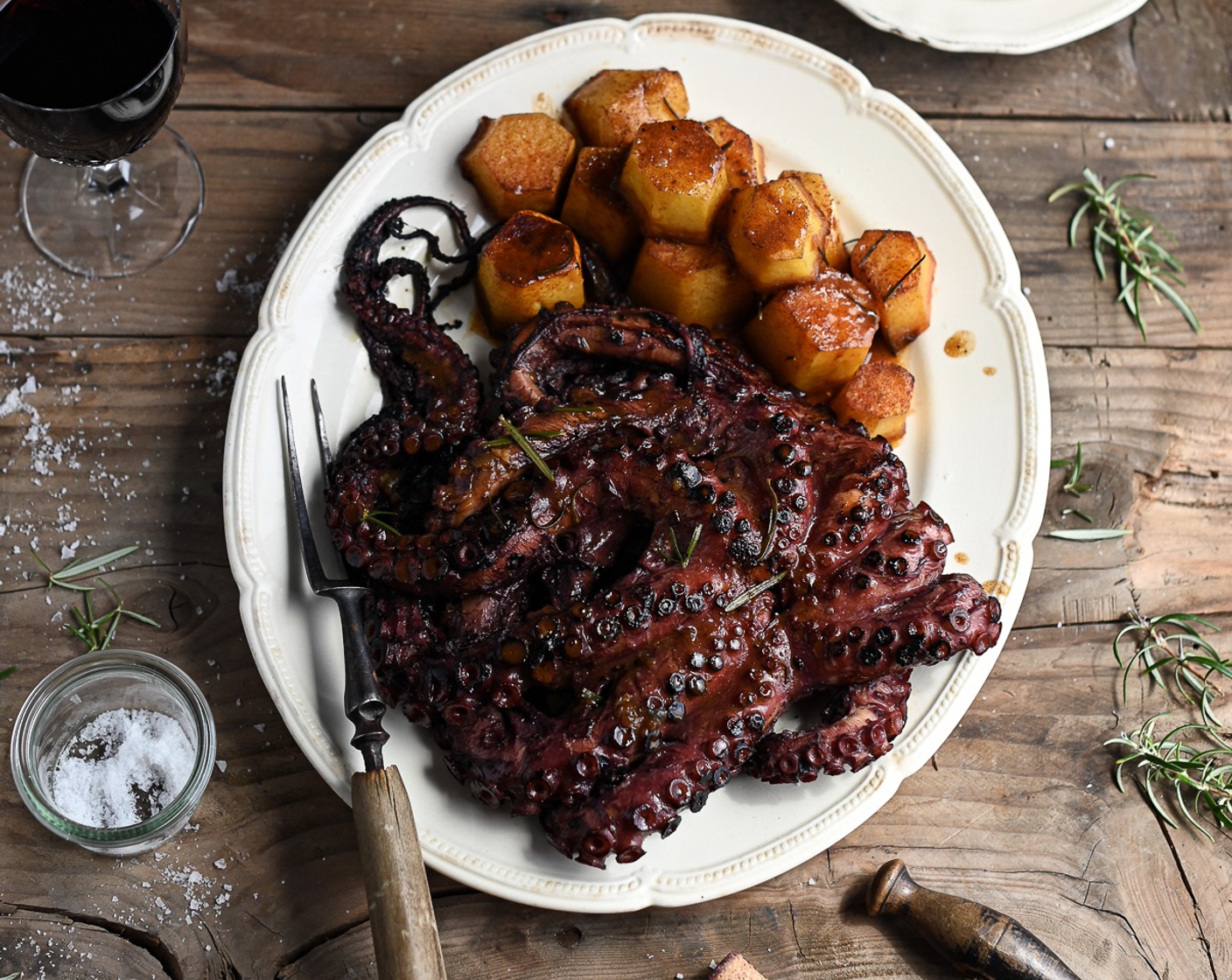 step 10 Transfer the roast potatoes and grilled octopus onto a warmed serving platter. Pour the leftover octopus cooking liquid into the potato pan and deglaze over high heat. Reduce the liquid until thickened and pour over the octopus and potatoes.