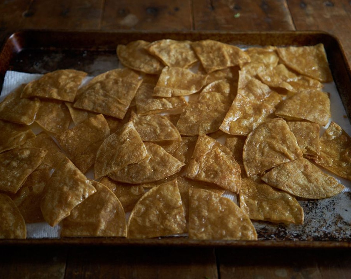 step 5 Add a single layer of tortilla wedges and fry until lightly brown, but not crisp, they should still bend without breaking. Drain on paper towels. Repeat until all tortillas are fried.