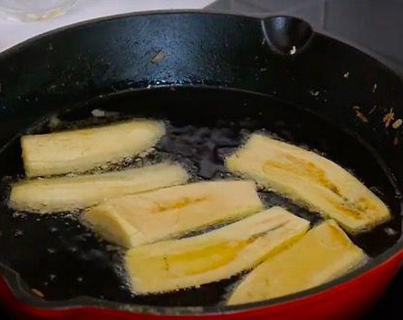 step 4 In the meantime slice the Plantains (2) and fry in abundant Vegetable Oil (as needed). Place the fried plantain over some kitchen paper to absorb the extra oil.